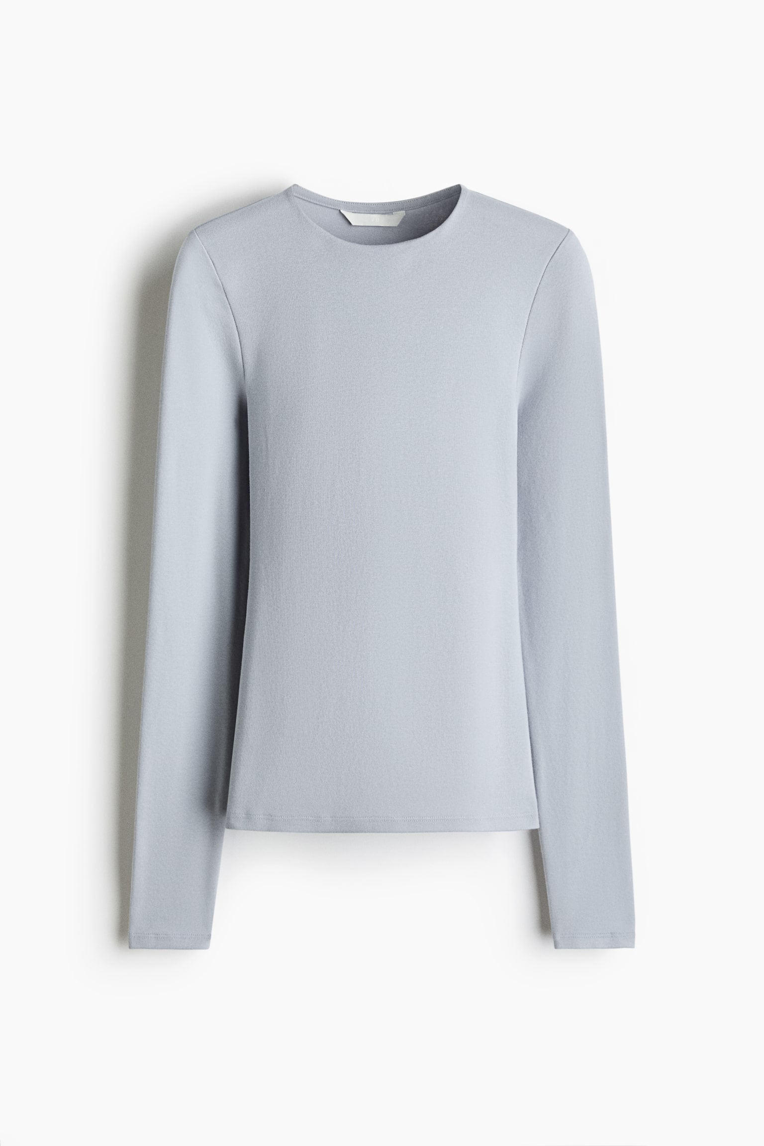 A light blue long-sleeved top is facing the front, featuring a crew neck, a fitted silhouette, and a straight hemline.