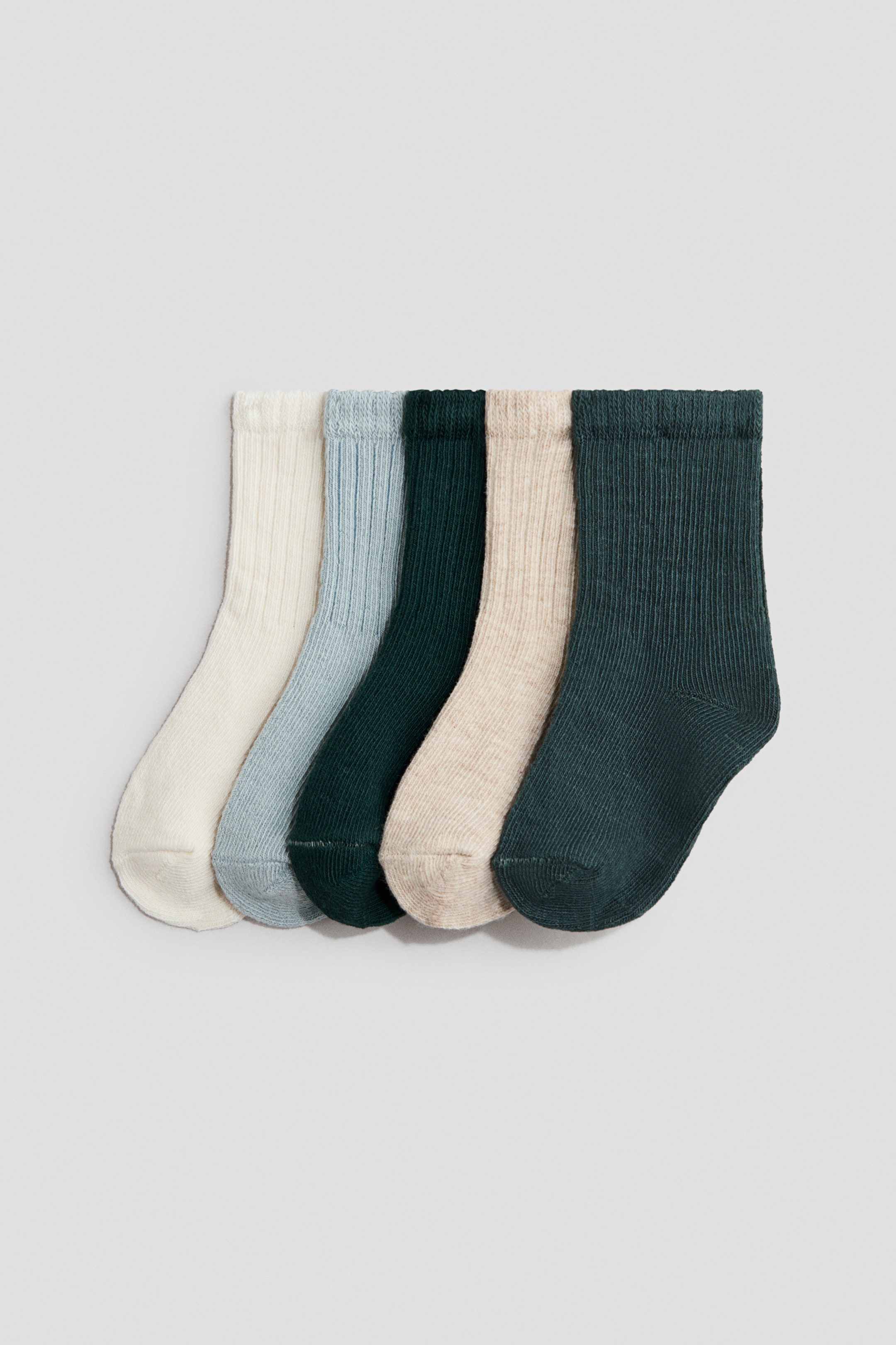 View larger image: Five fine-knit socks are displayed in a frontal view, showcasing ribbed shafts and elasticated tops, available in cream, light blue, dark green, beige, and dark teal.