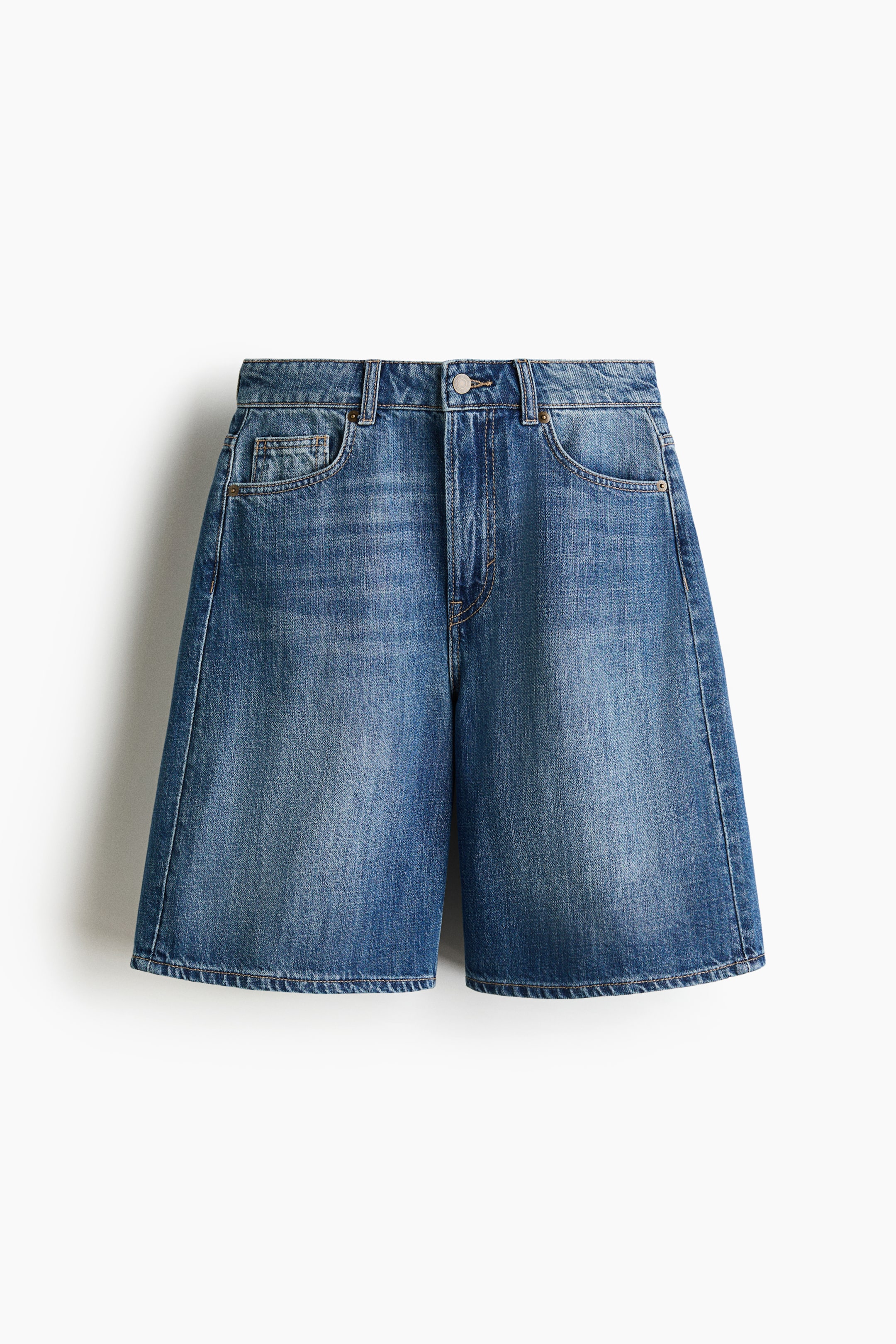 View larger image: Knee-length, 5-pocket shorts are shown in a front view, made from rigid cotton denim. They feature a high waist, a zip fly, a button closure at the waist, and visible front pockets, including a coin pocket.