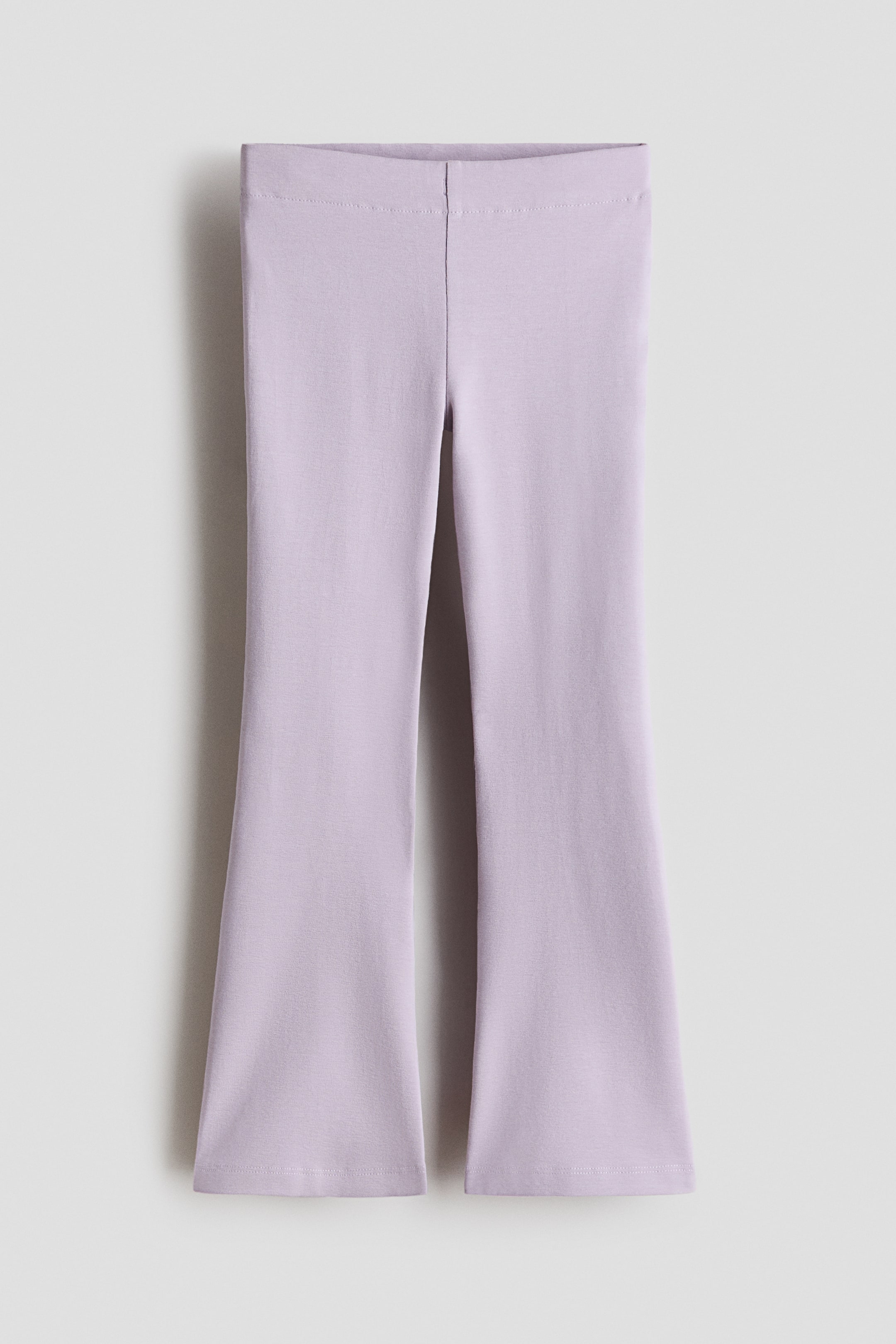 View larger image: Light purple soft cotton jersey leggings with an adjustable, elasticated waist and flared legs, shown from the front.