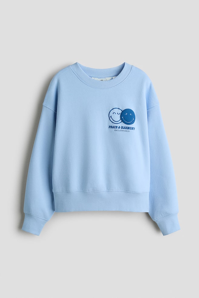 Sweatshirt mit Motivprint - Hellblau/SmileyWorld®/Mattlila/Hello Kitty - 1