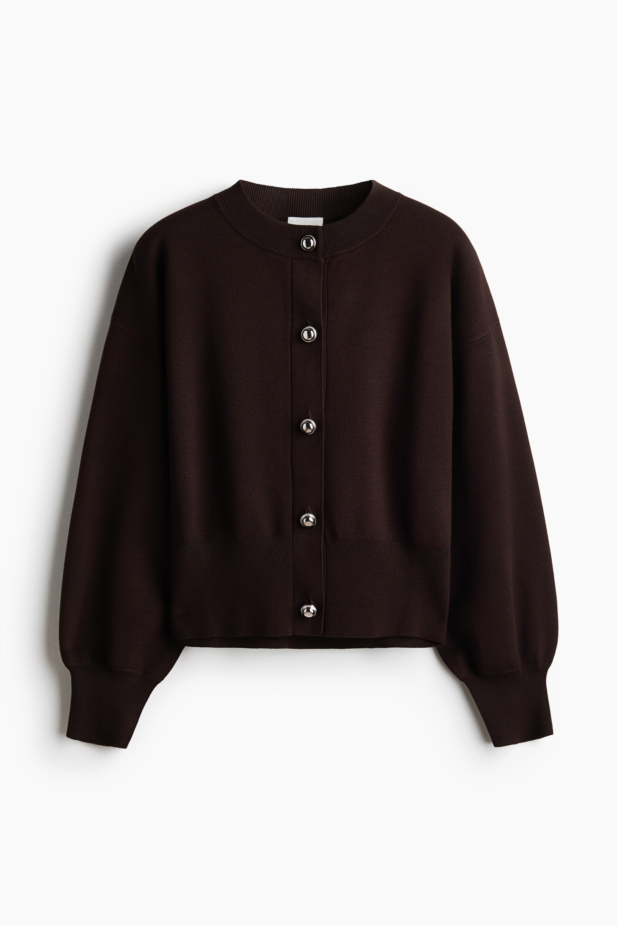 View larger image: A dark brown fine-knit cardigan is shown from the front, featuring a round rib-trimmed neckline, dropped shoulders, and long sleeves with wide ribbed cuffs. Five metallic silver dome buttons run down the center front, and a ribbed hem finishes the bottom.