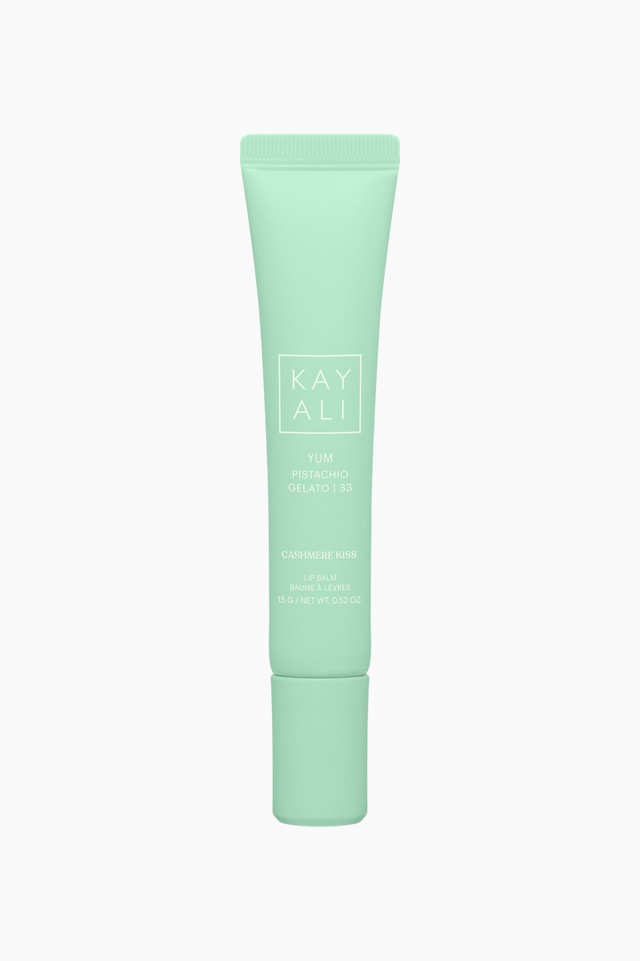 Vis større bilde: En lysegrønn squeeze-tube i mintfarge av Kayali Yum Pistachio Gelato | 33 Cashmere Kiss Lip Balm står loddrett og har en matt finish samt en matchende skrukork nederst. Forsiden av tuben viser merkenavnet «KAYALI» inne i en hvit firkant, sammen med produktdetaljene i hvit skrift.