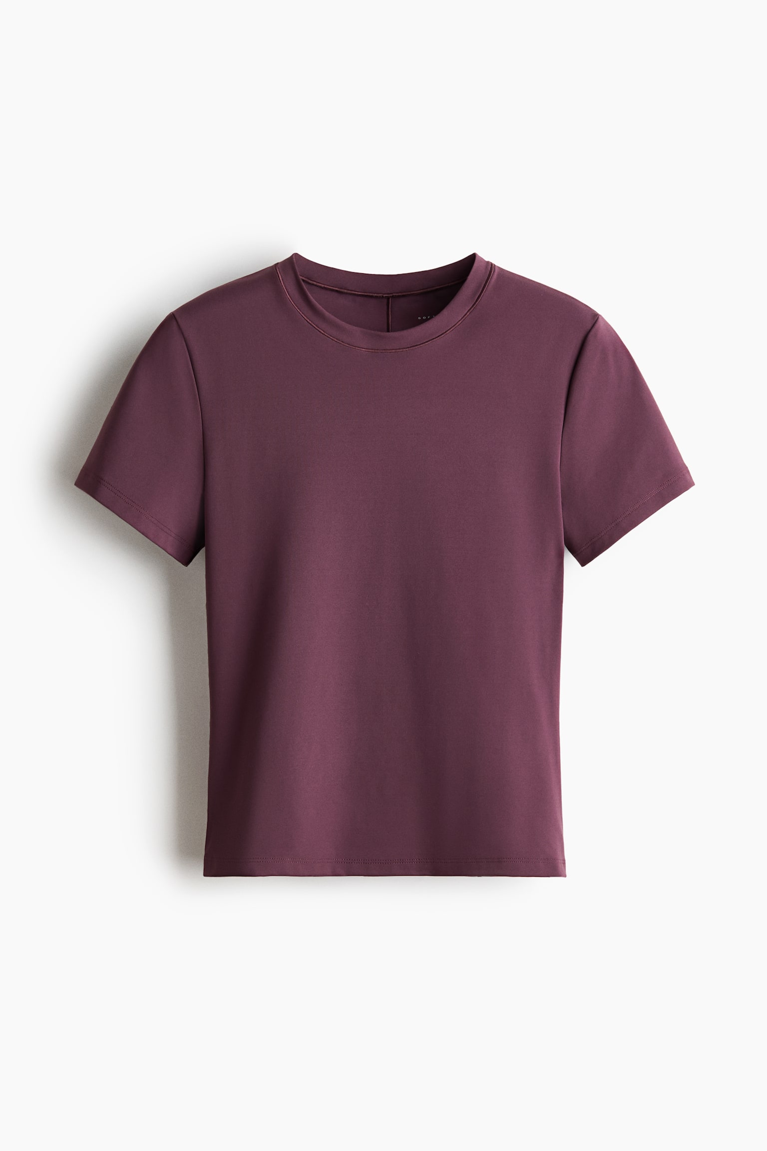 The lightweight yoga top is presented in a rich maroon hue, boasting short sleeves and a ribbed crew neck design. It is laid out flat and facing forward, highlighting its sleek fabric. - 1