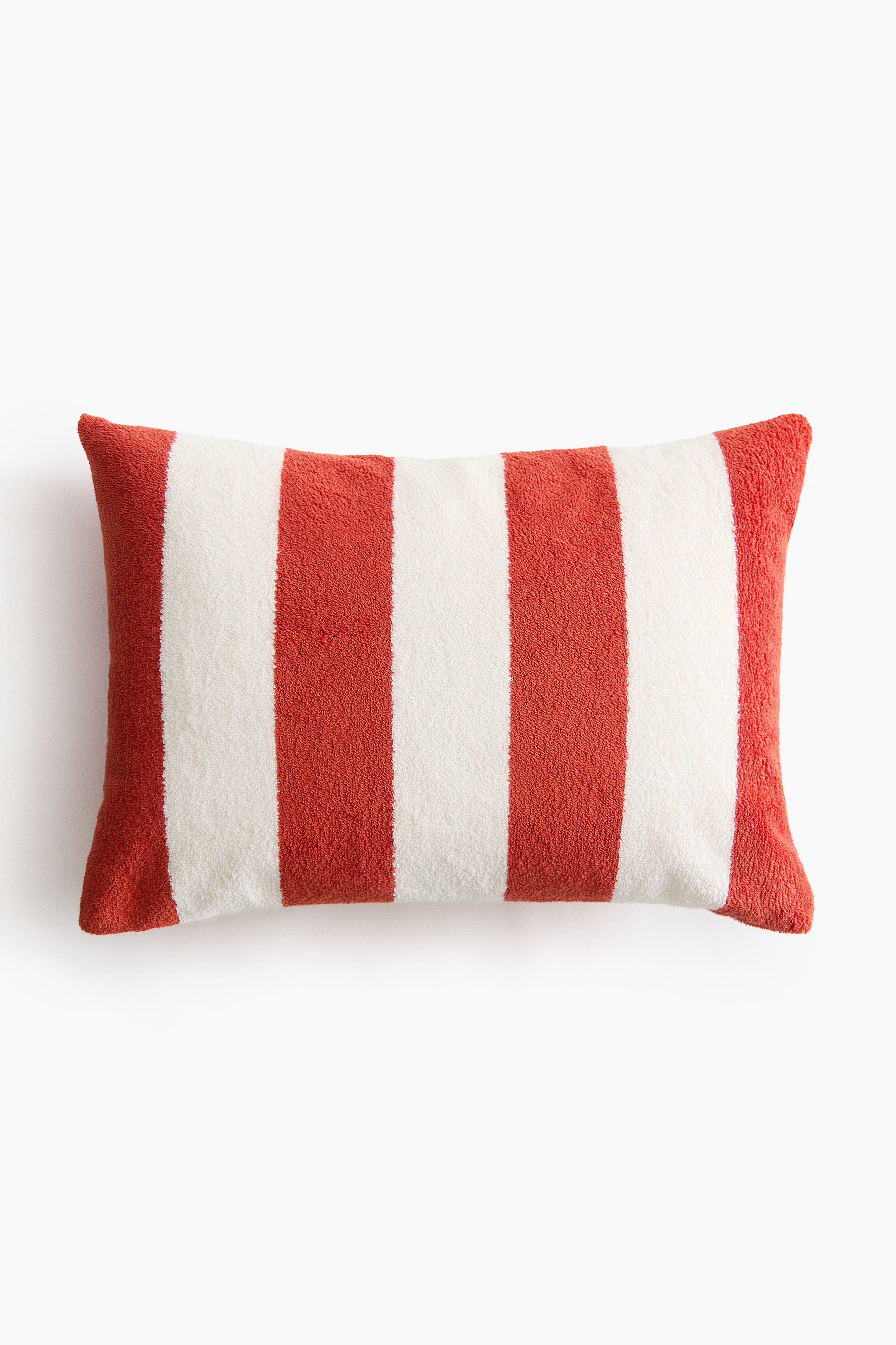 View larger image: A rectangular pillow is facing forward, showcasing alternating vertical stripes in white and reddish-orange, and features a soft, terry texture.