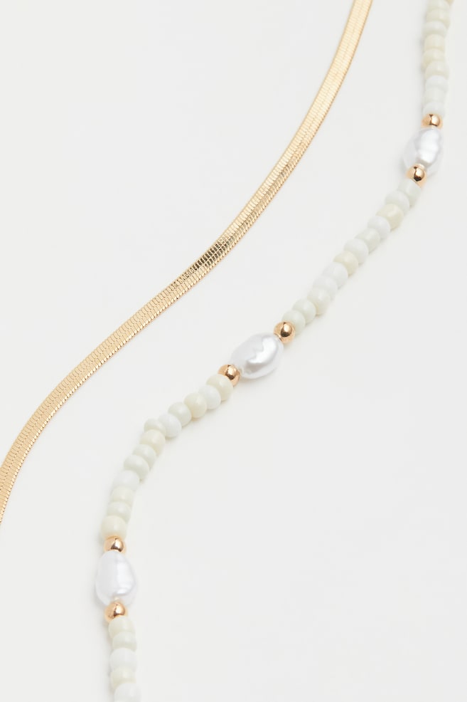 Two-strand necklace - Gold-coloured/White/Gold-coloured/Green - 3