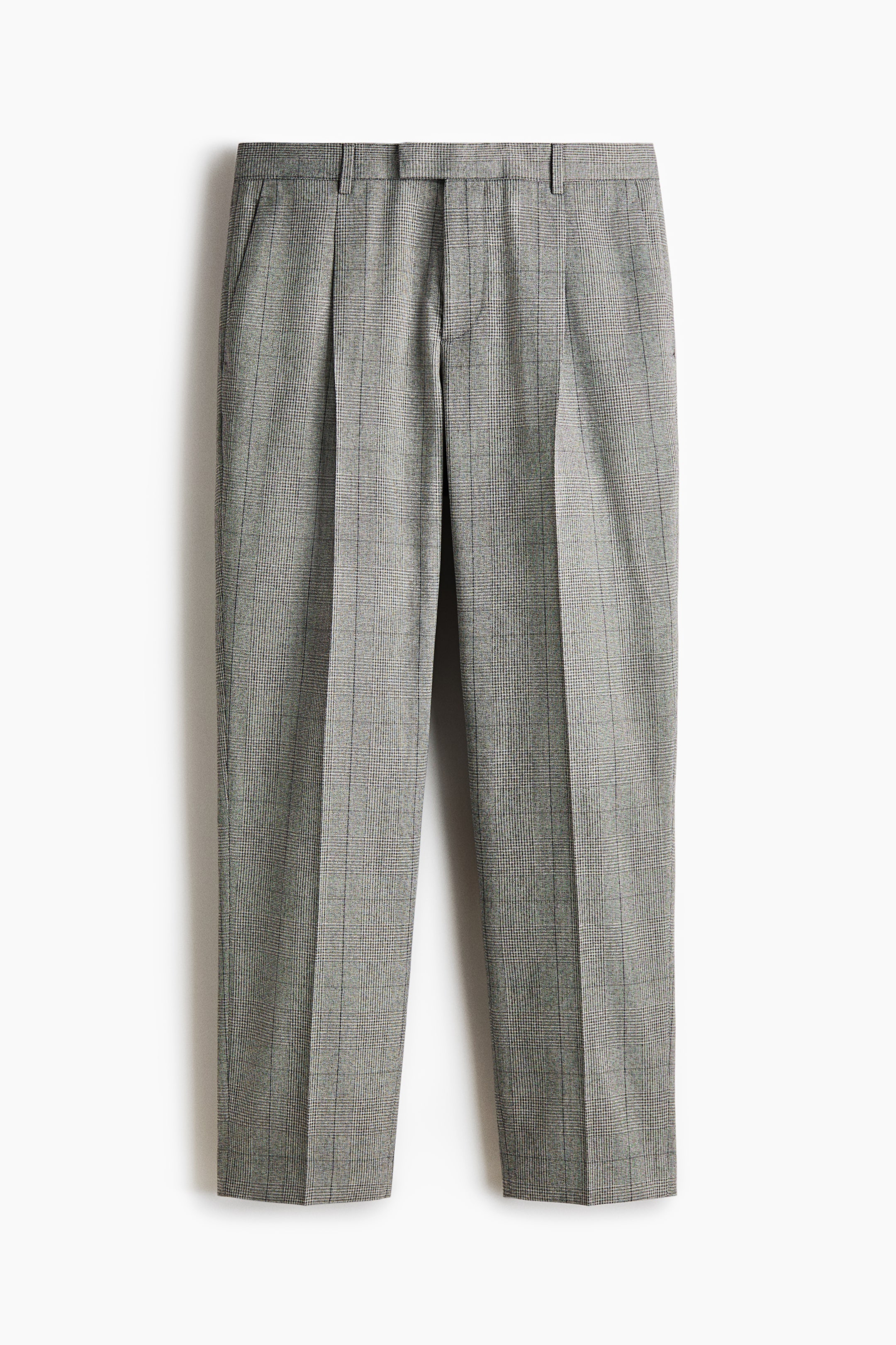 View larger image: The suit trousers are presenting from the FRONT, featuring a gray woven fabric with a check pattern. They are designed with an extended waistband that includes a concealed zip fly and a concealed button and hook-and-bar fastener. Diagonal side pockets are visible, and pleats form below the waistband, with creases running down the front of the regular fit legs.