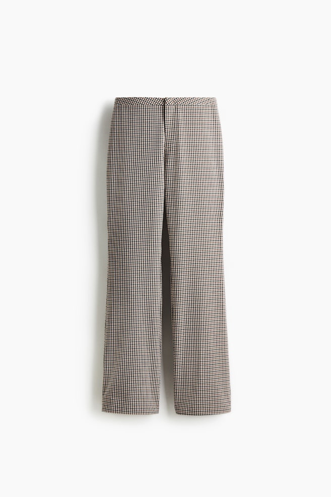 A pair of pants is presented facing front, featuring a miniature black and off-white houndstooth check pattern. The pants have a flat-front waistband and straight-cut legs. - 1