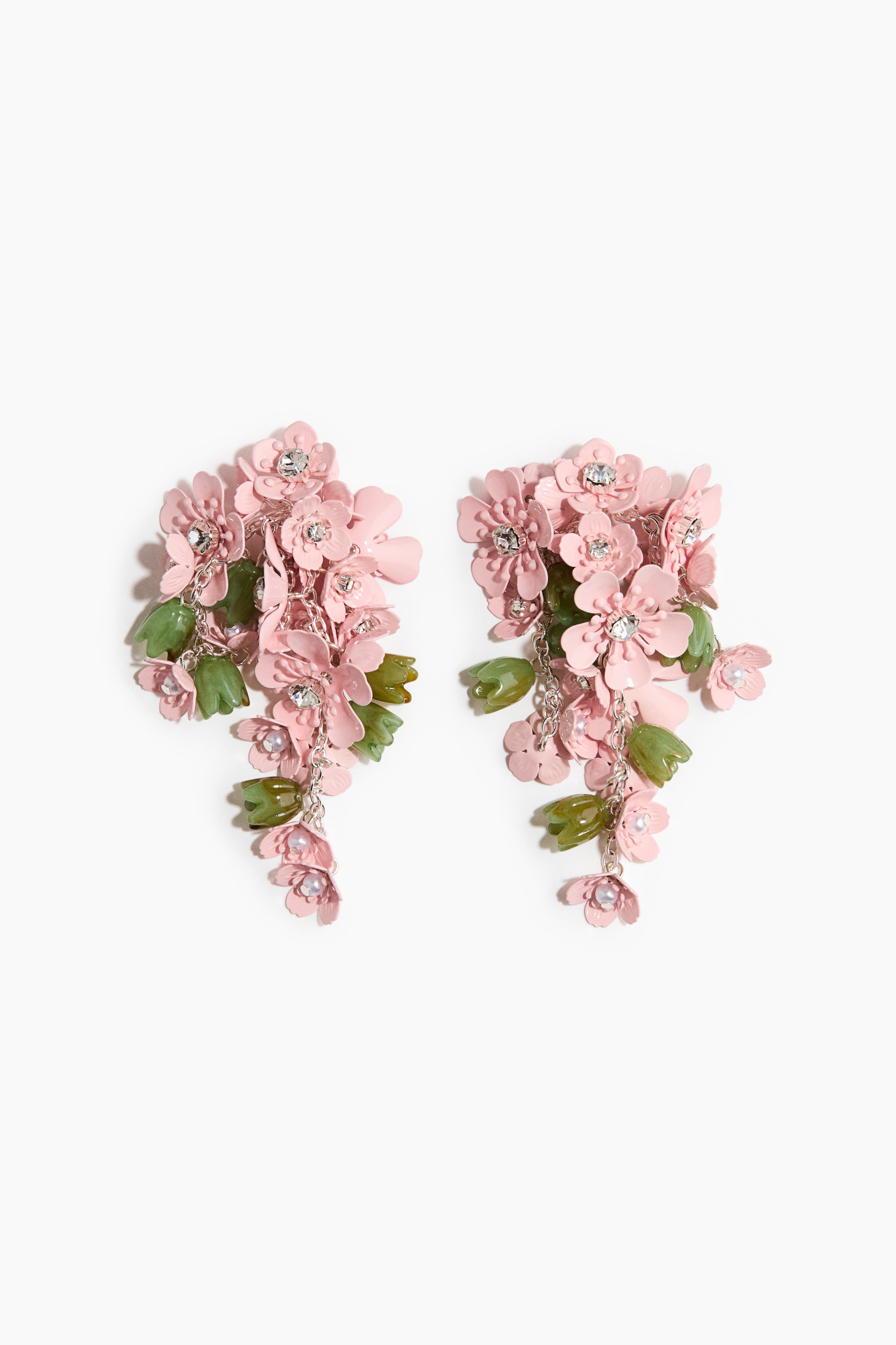 View larger image: A pair of chandelier earrings showcases clusters of pink flowers, each centred with a clear crystal, and green leaf-like elements. Silver-toned chains connect the components, with small white pearls dangling, all facing forward.