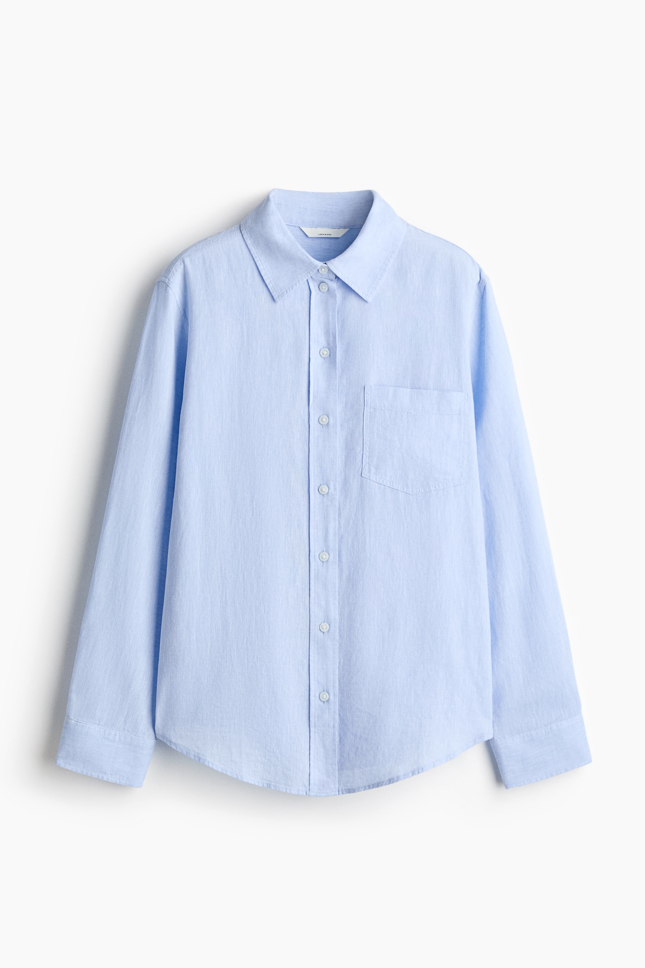 View larger image: FRONT: A light blue shirt, crafted with an airy weave texture, showcases a collar, buttons down the front, and an open chest pocket. It also features long sleeves with buttoned cuffs and a rounded hem.