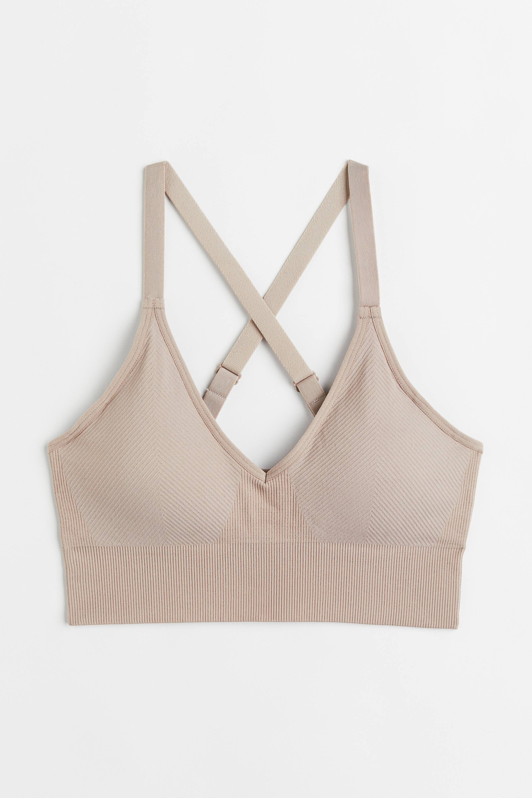 View larger image: Seamless Medium-Support Sports Bra with DryMove™ - Light beige - Ladies | H&M US 1