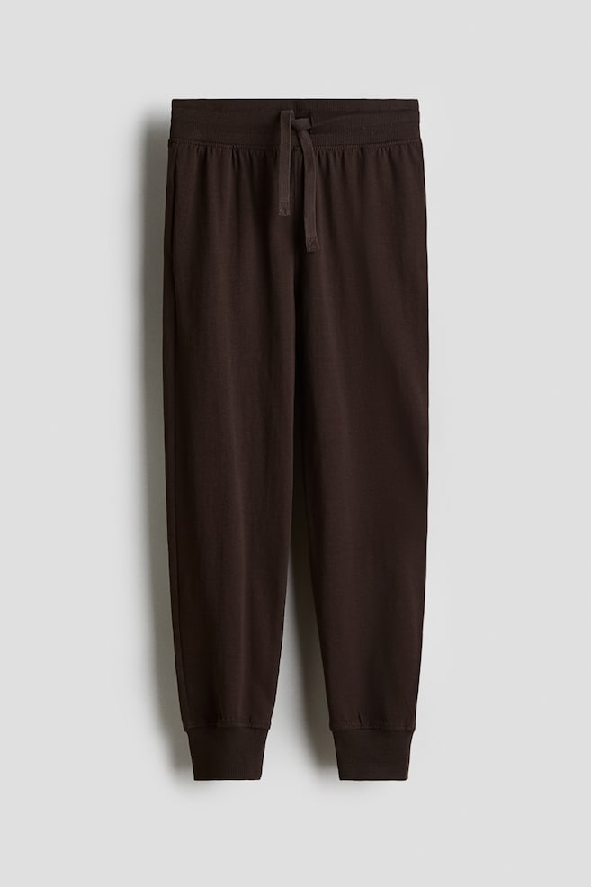 Kalhoty jogger z bavlněného žerzeje - Tmavě hnědá - 1