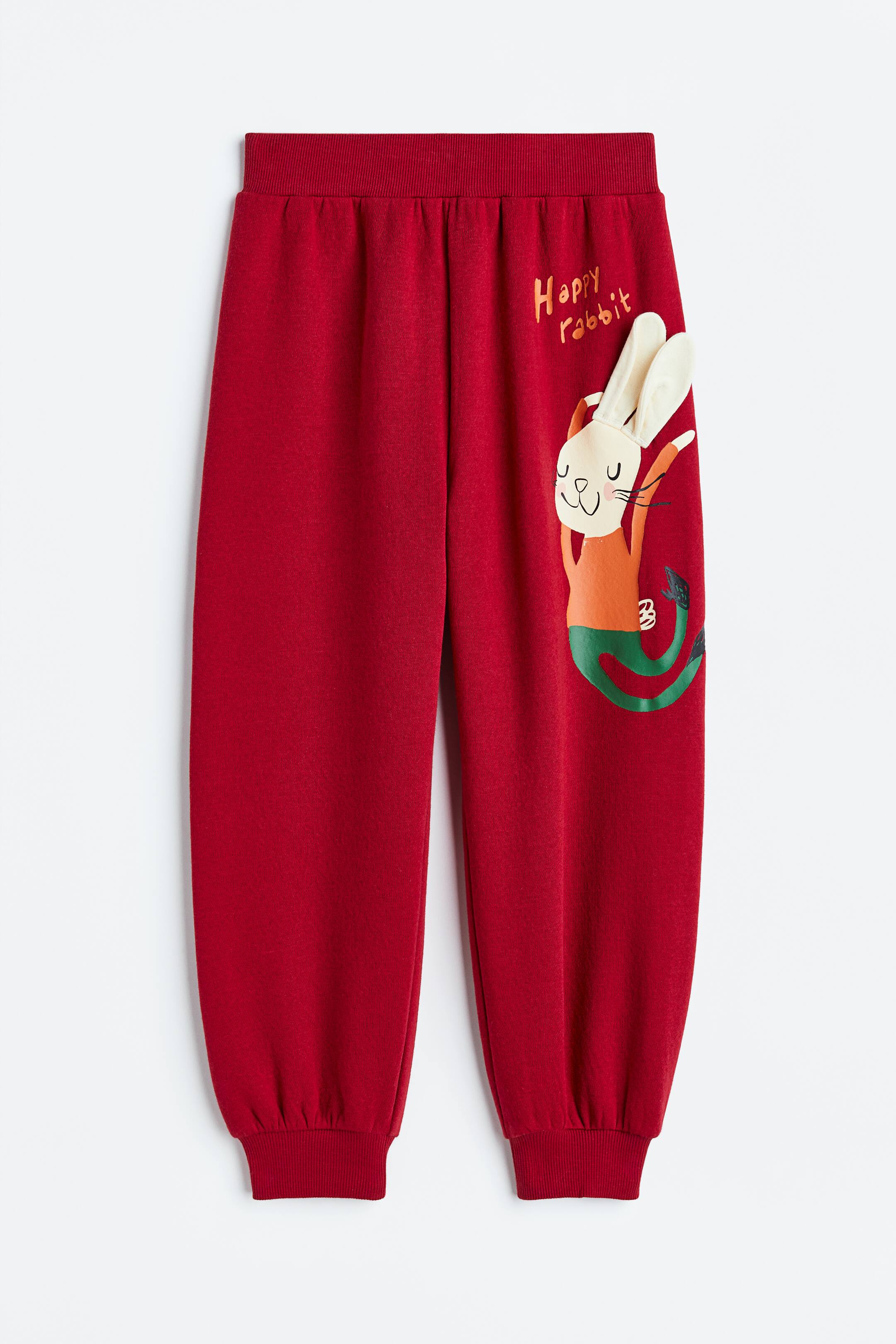 Xem ảnh lớn hơn: Quần jogger in hình đính trang trí - Màu đỏ/Thỏ - Kids | H&M VN 1