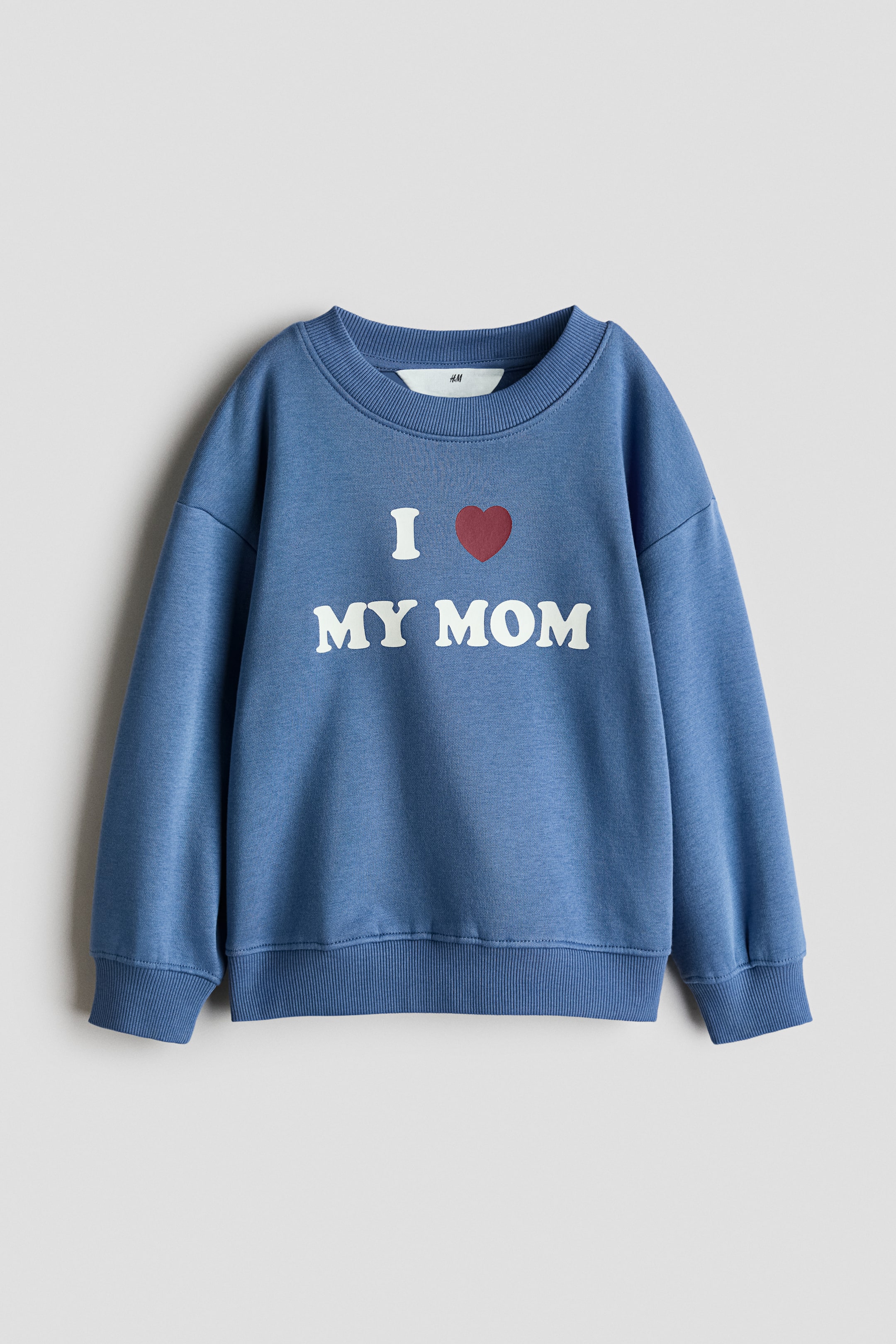 View larger image: A blue sweatshirt showcasing a white "I ❤️ MY MOM" graphic with a red heart on its front, detailed with a ribbed crew neck, ribbed cuffs, and a ribbed hem.