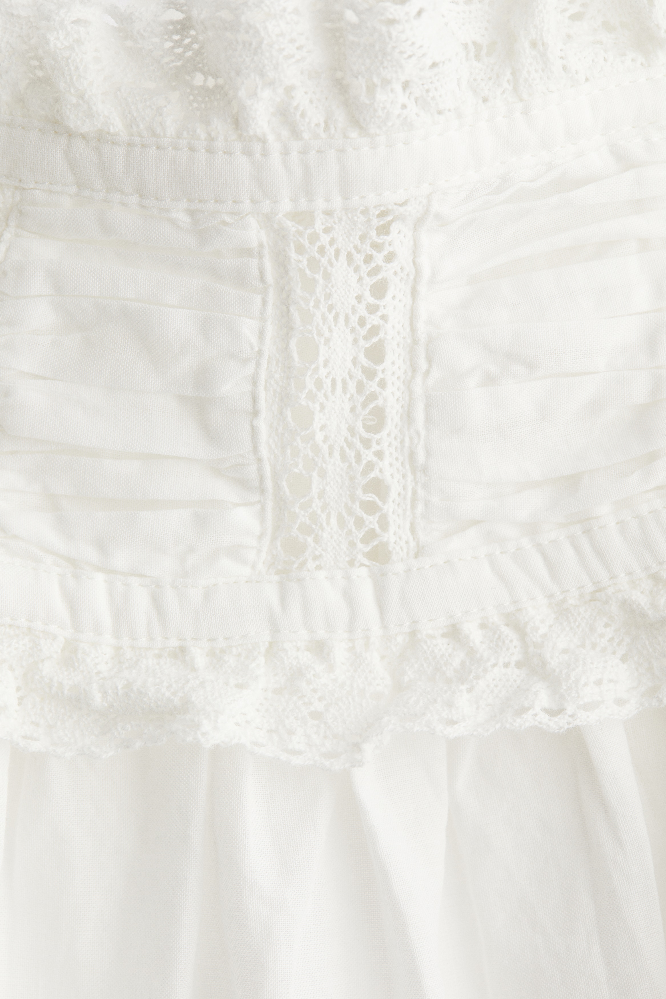 Lace-trimmed cotton blouse