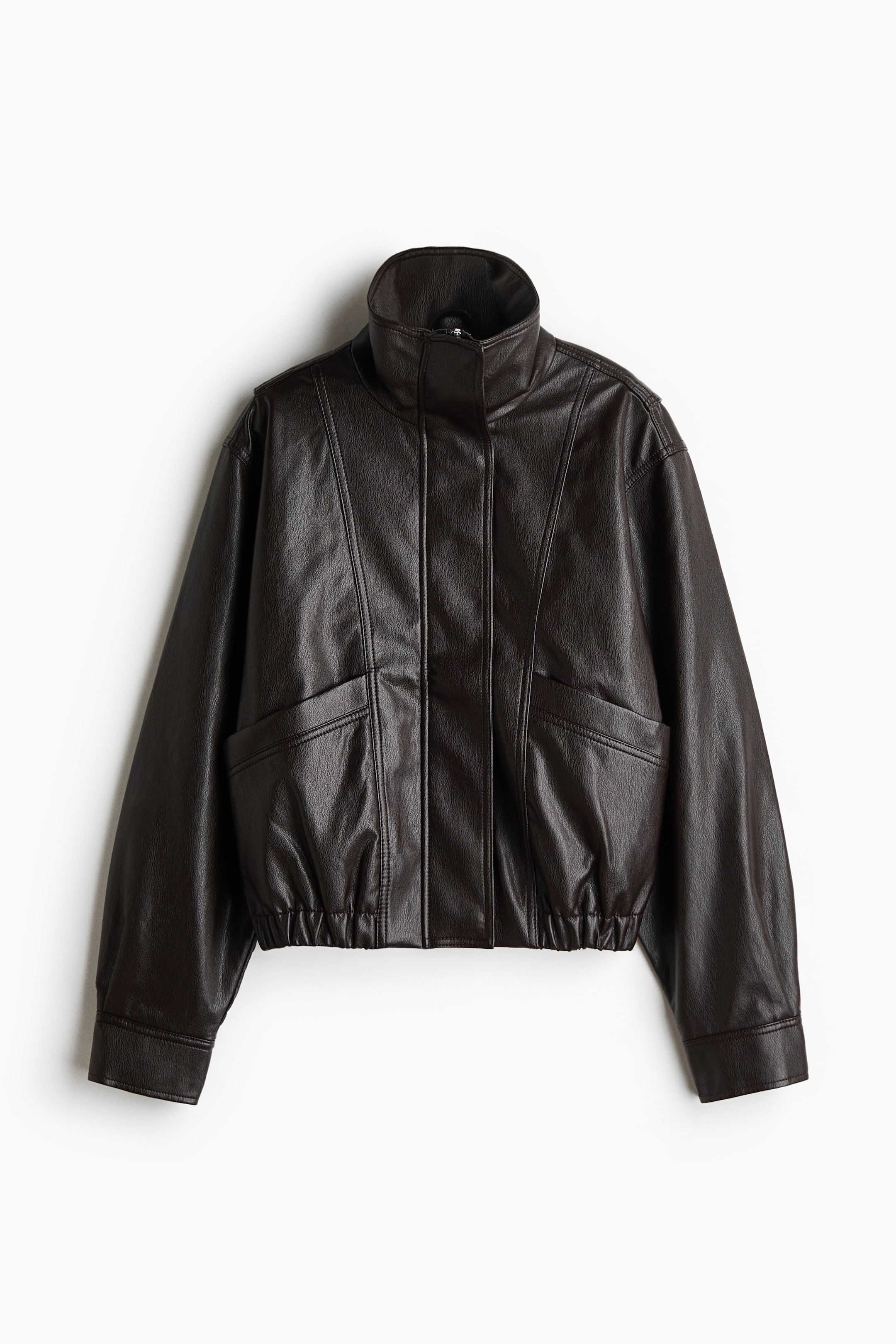 View larger image: A dark brown faux leather jacket features a stand collar and a center front zipper closure concealed by a placket. It showcases two flap pockets on the lower front, defined by vertical and angled seam lines, long sleeves, and an elasticized hem.