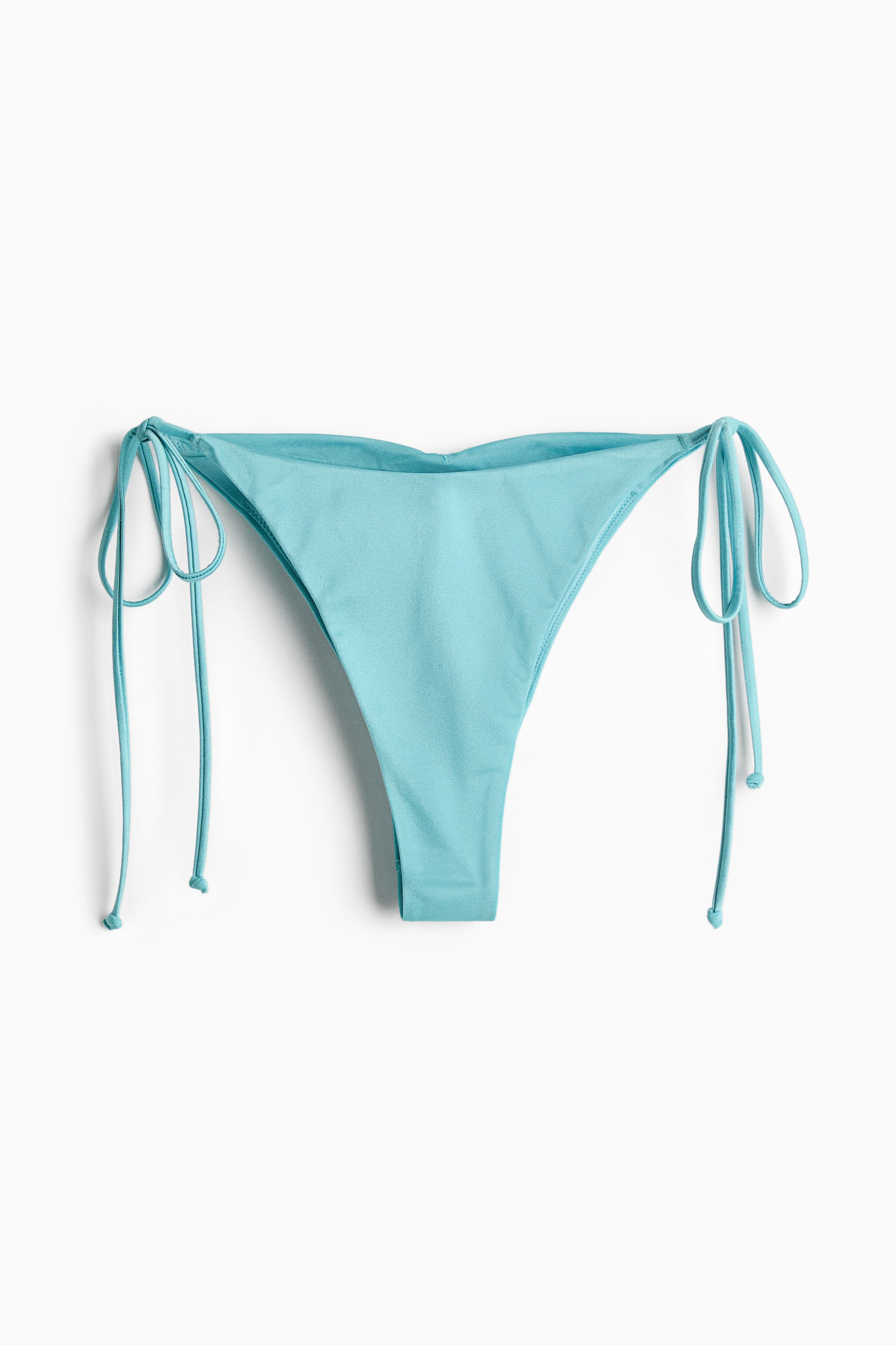 Ingrandisci l'immagine: Slip bikini azzurro chiaro con vita media e lacci ai lati.