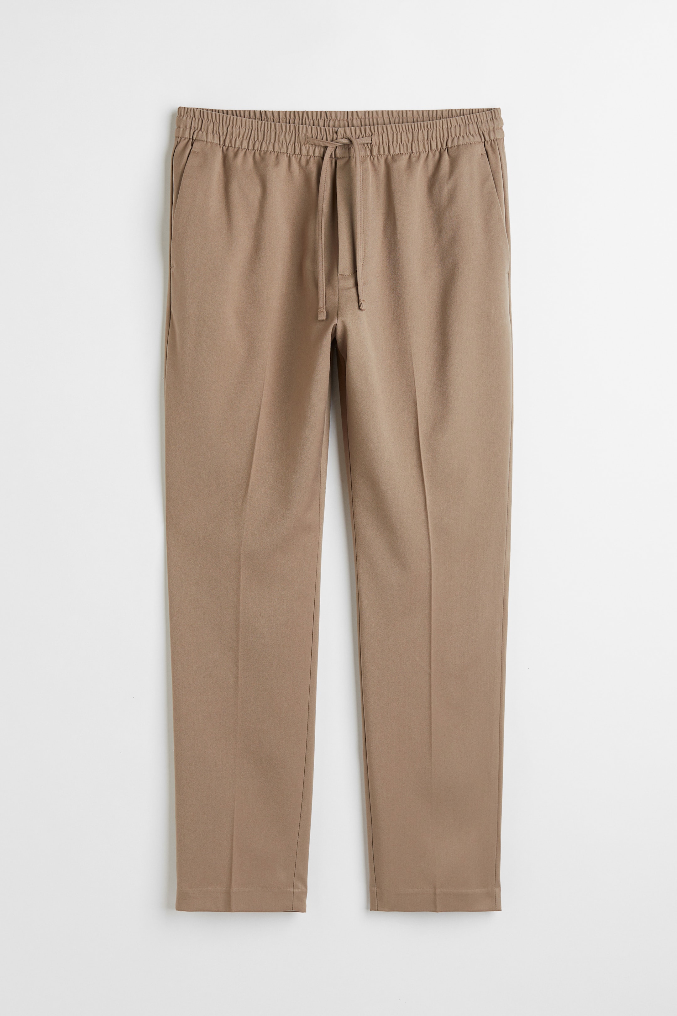 הצגת תמונה גדולה יותר: מכנסי טרנינג Slim Fit - Beige - Men | H&M IL 1