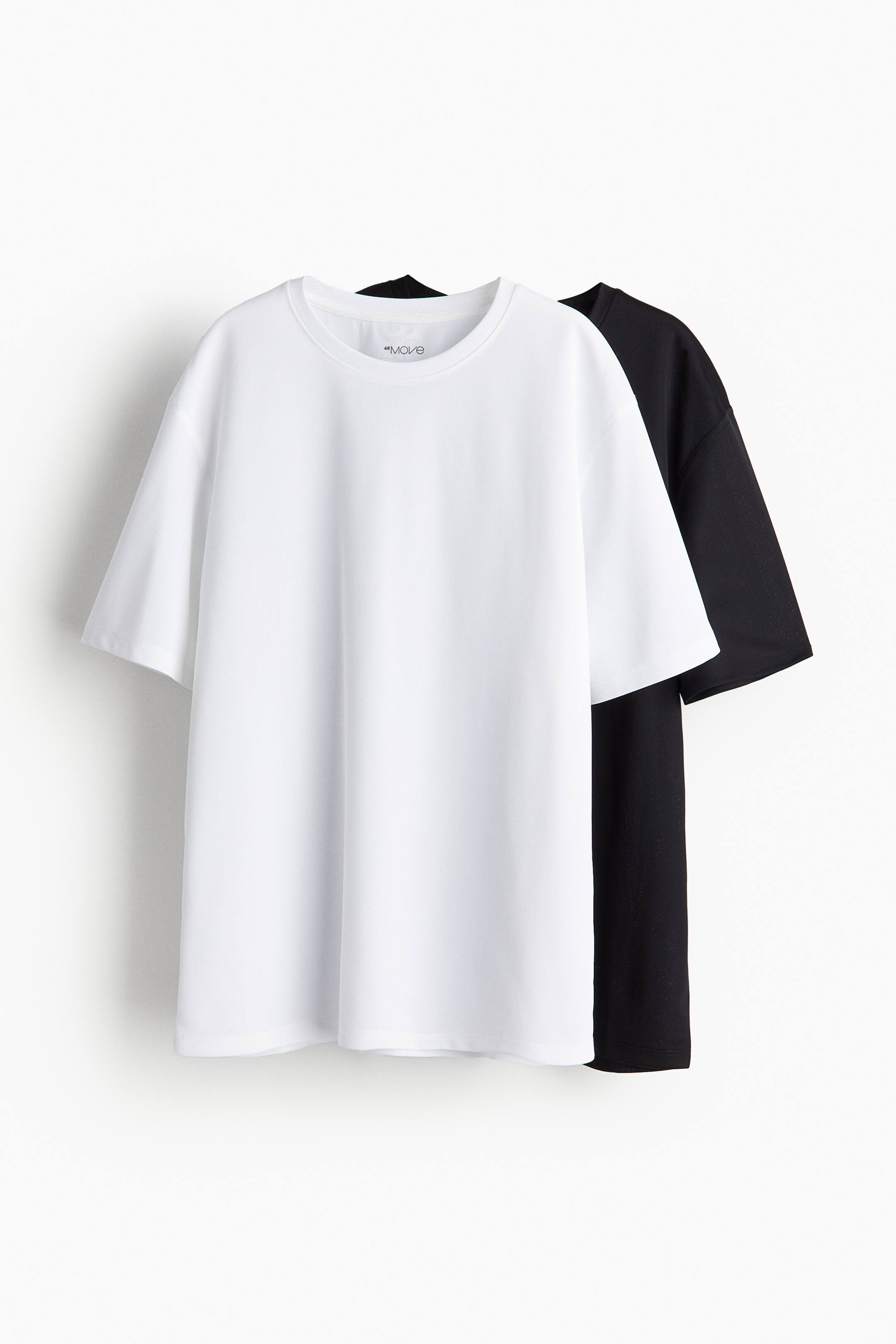 Ver imagem maior: Pack de 2 camisolas de desporto em DryMove™ - Preto/Branco - CRIANÇA | H&M PT 1