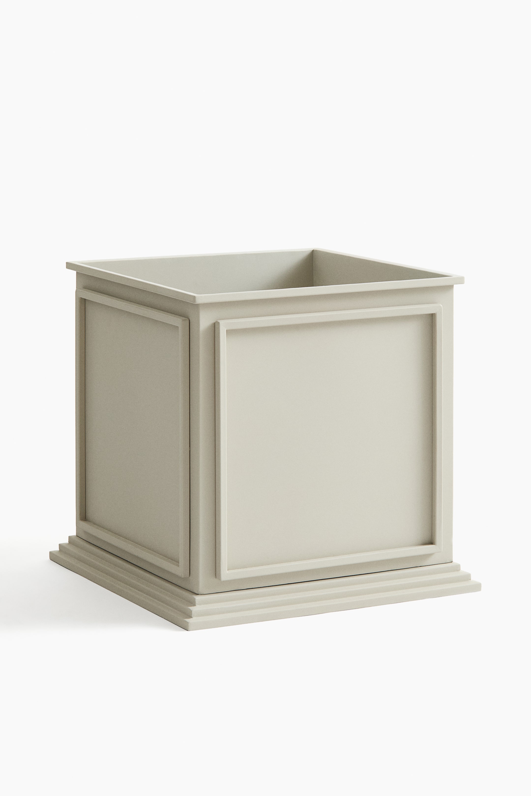 View larger image: A large metal plant pot, 41 cm high and 43 cm long, is showcasing its front and right sides. It boasts a light grey finish, a square opening with a flat rim, raised rectangular panels on its sides, and a tiered plinth-like base.