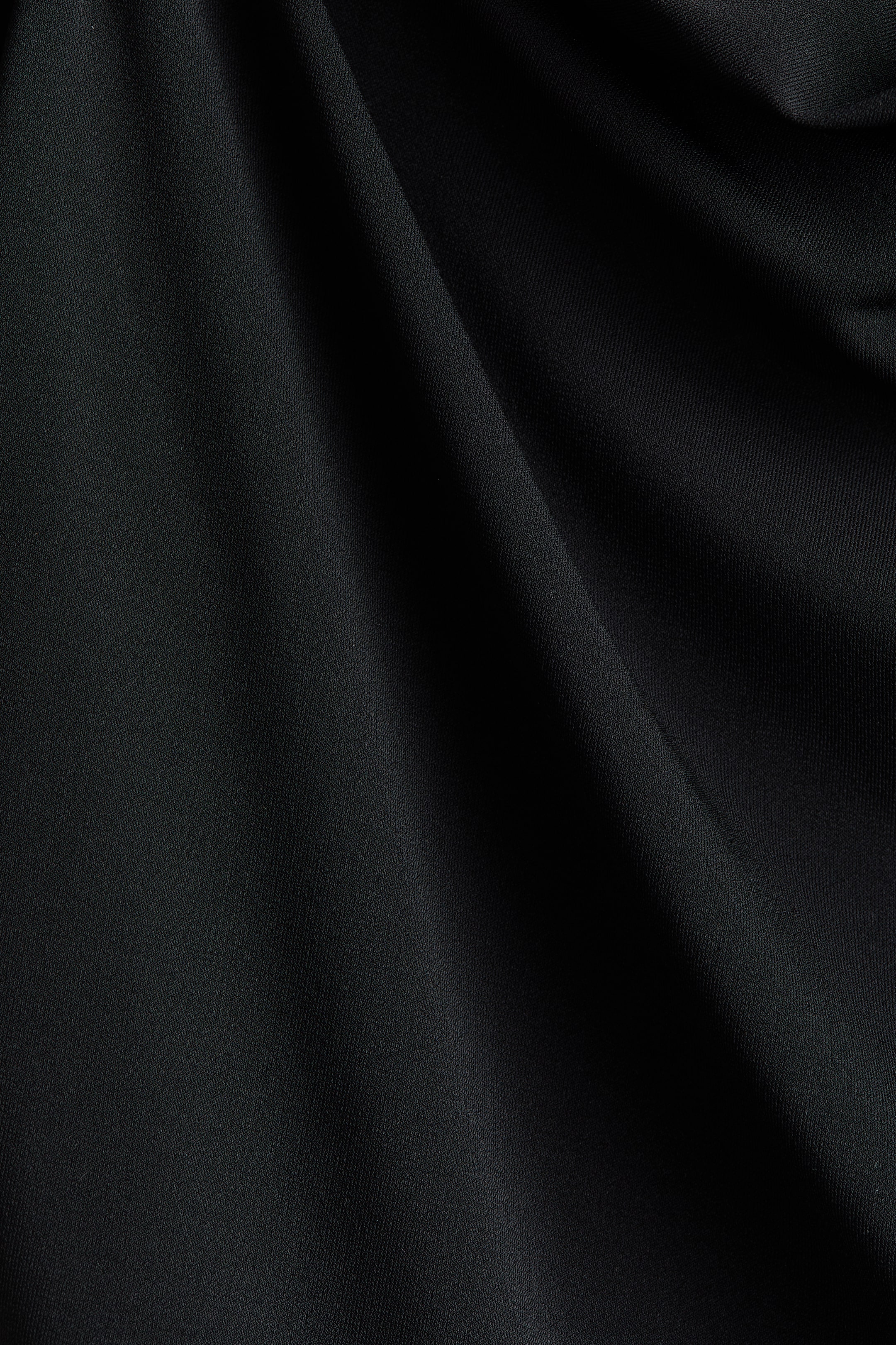 Draped Asymmetric Top
