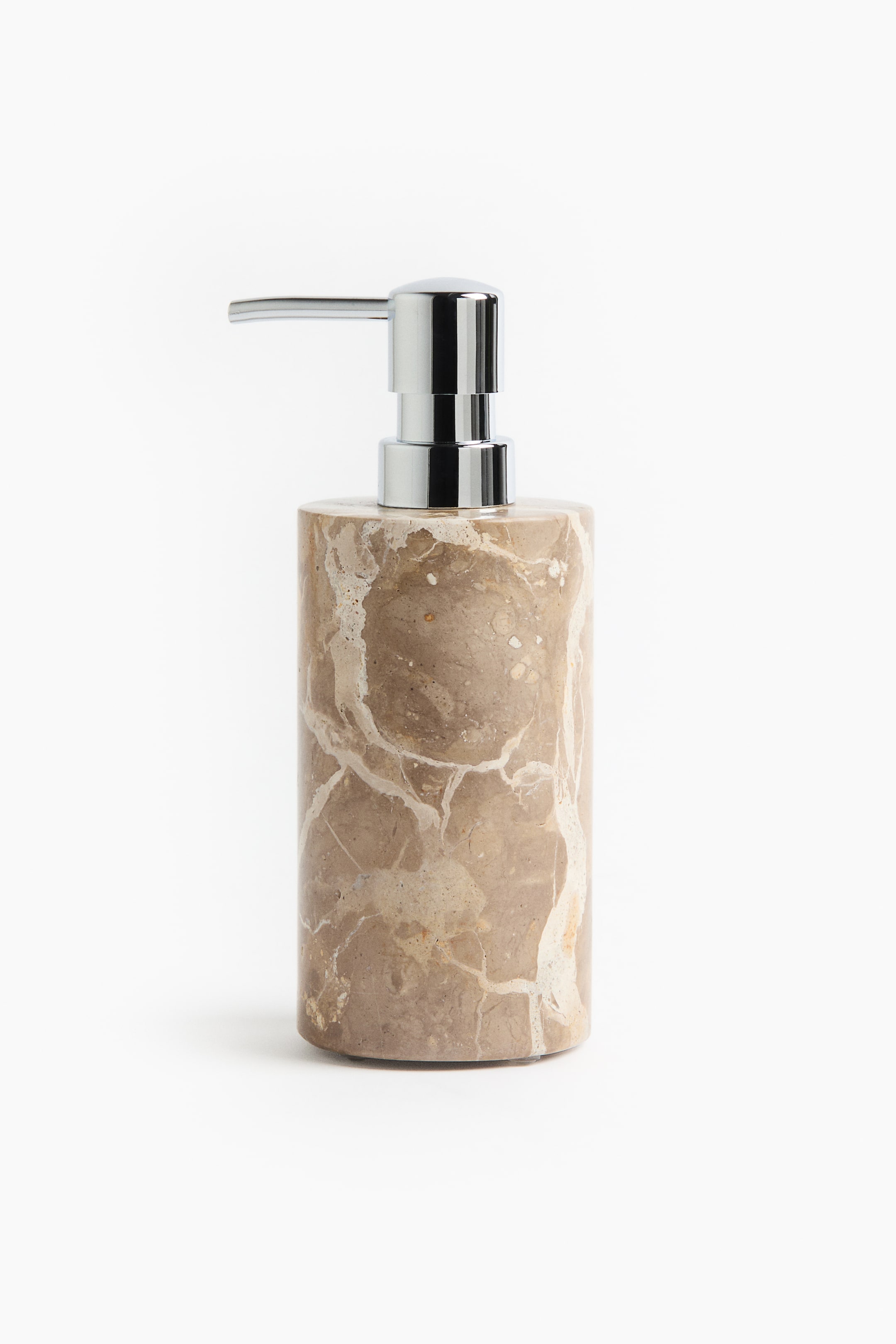 View larger image: A cylindrical soap dispenser is positioned front-facing, showcasing a natural brown marble body with unique white veining. A shiny chrome pump mechanism tops the dispenser.