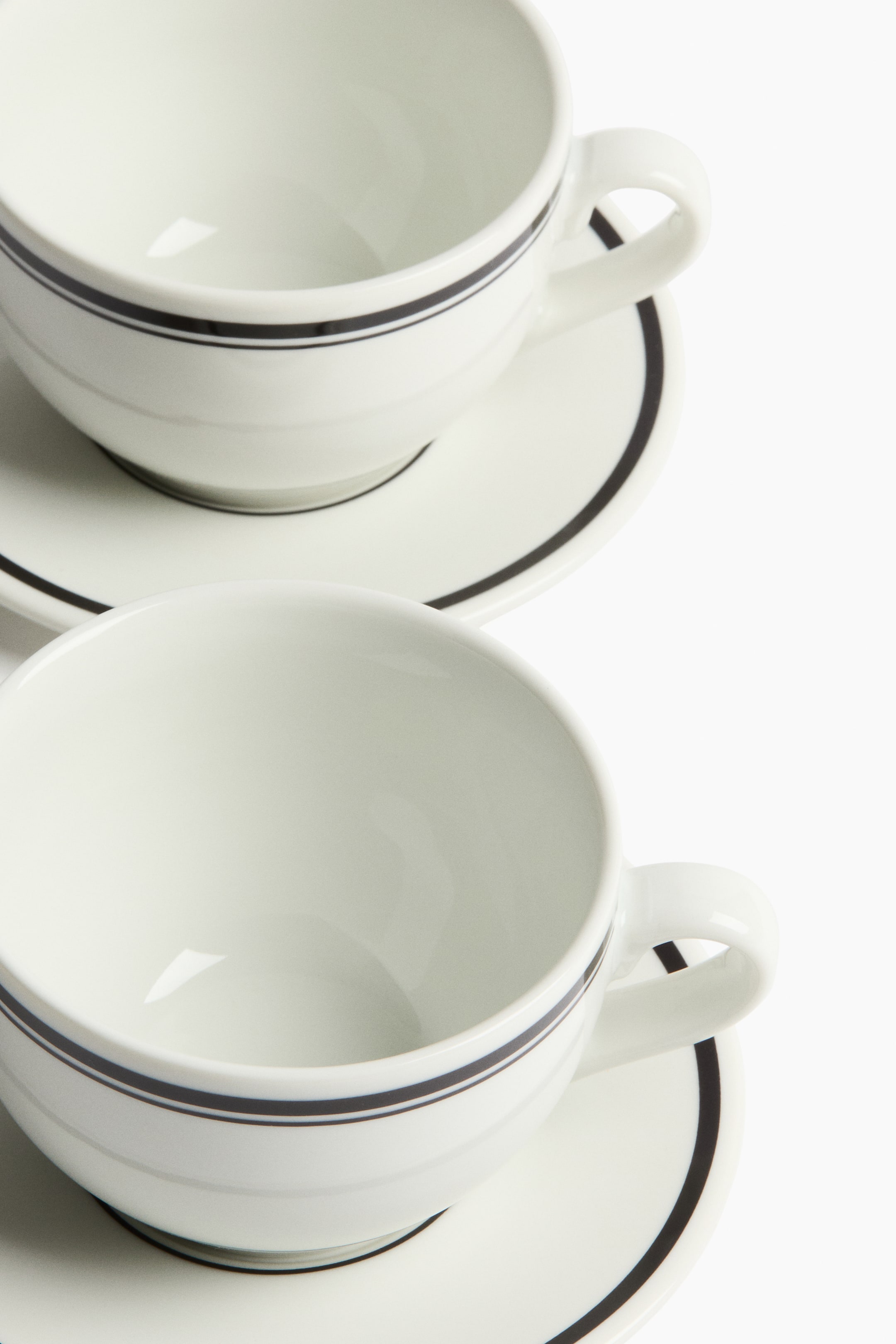 View larger image: 2-Pack Porcelain Cups with Saucers - White/black | H&M US 3