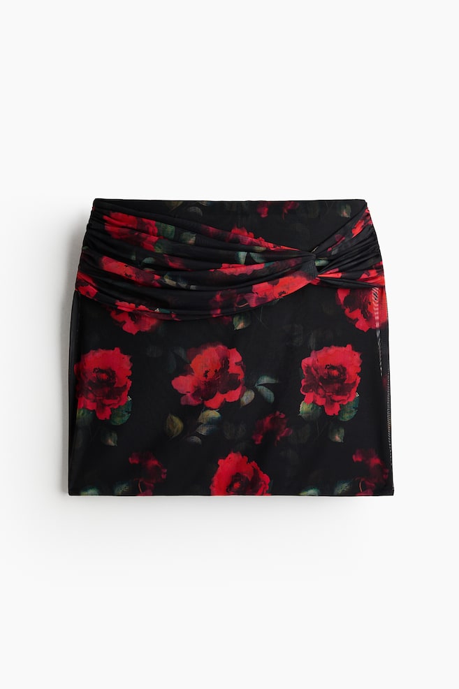 Minifalda con detalle enlazado - Negro/Rosas - 1