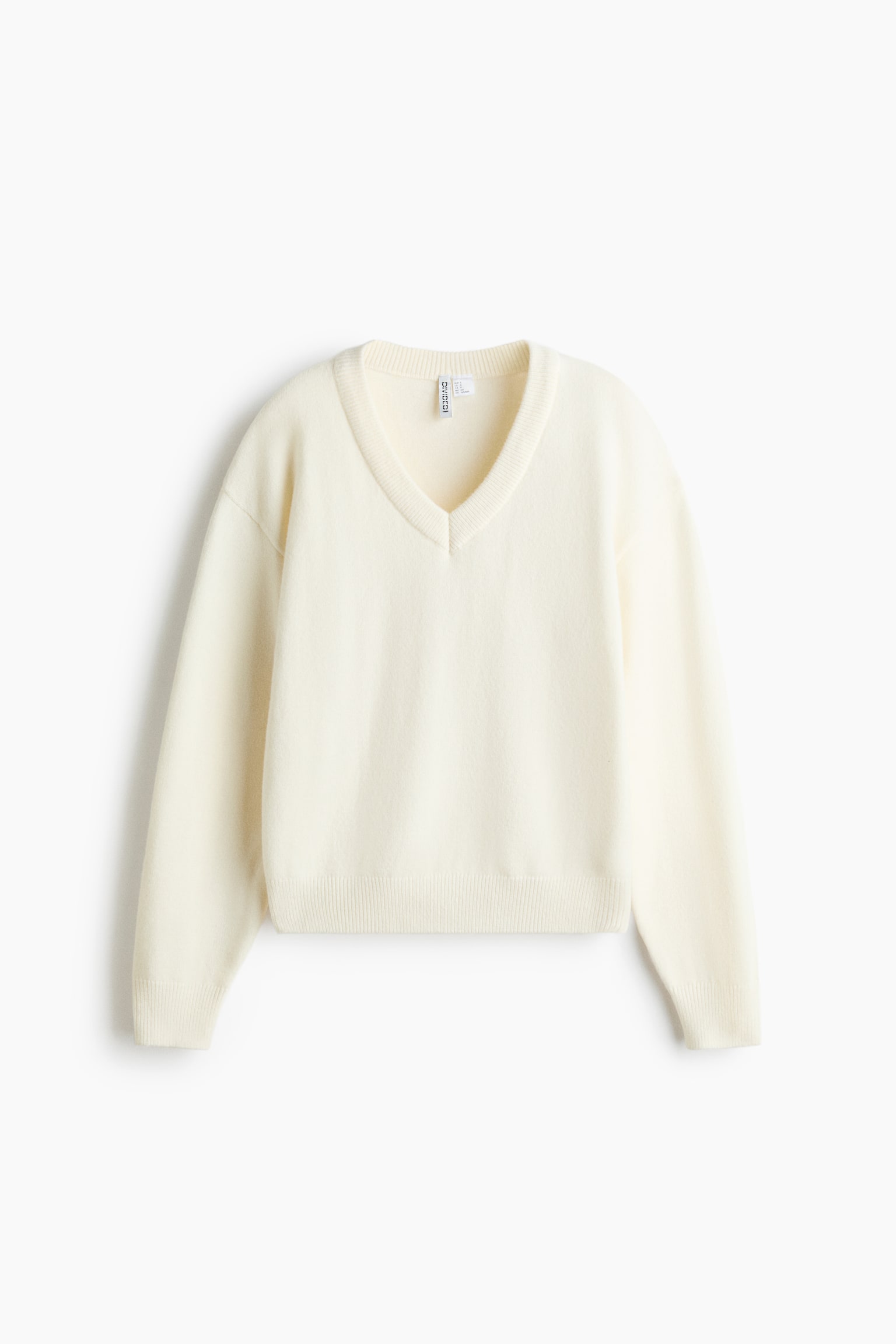Jersey con escote en V - Crema