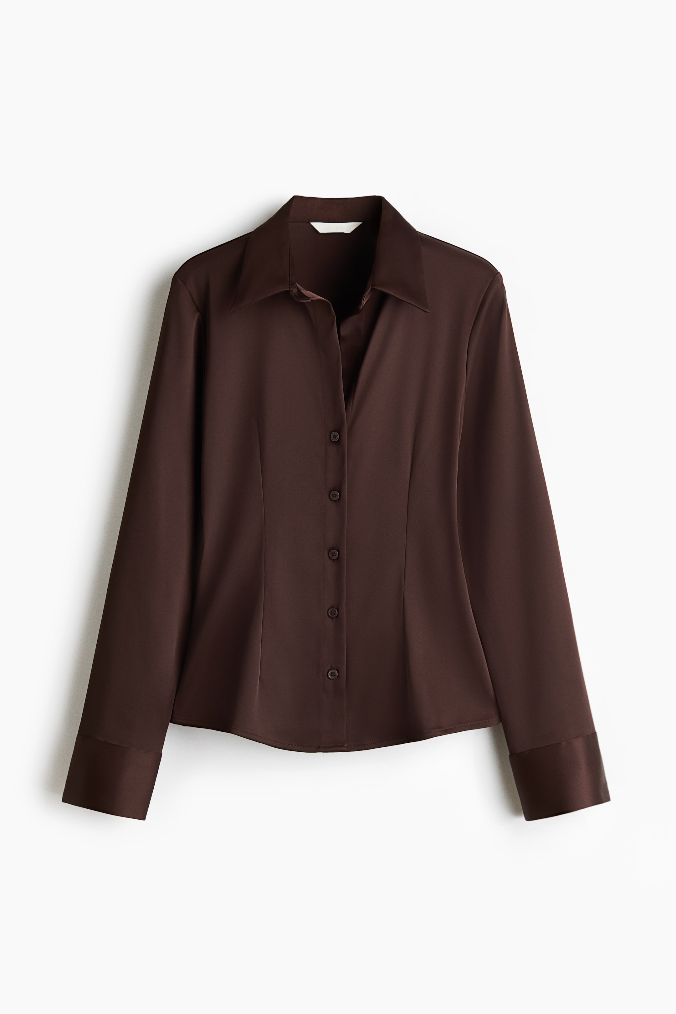 View larger image: A chocolate brown button-down shirt is displayed facing front, featuring a pointed collar, a full placket with matching buttons, and long sleeves with wide folded cuffs. The fabric has a smooth, lustrous finish.