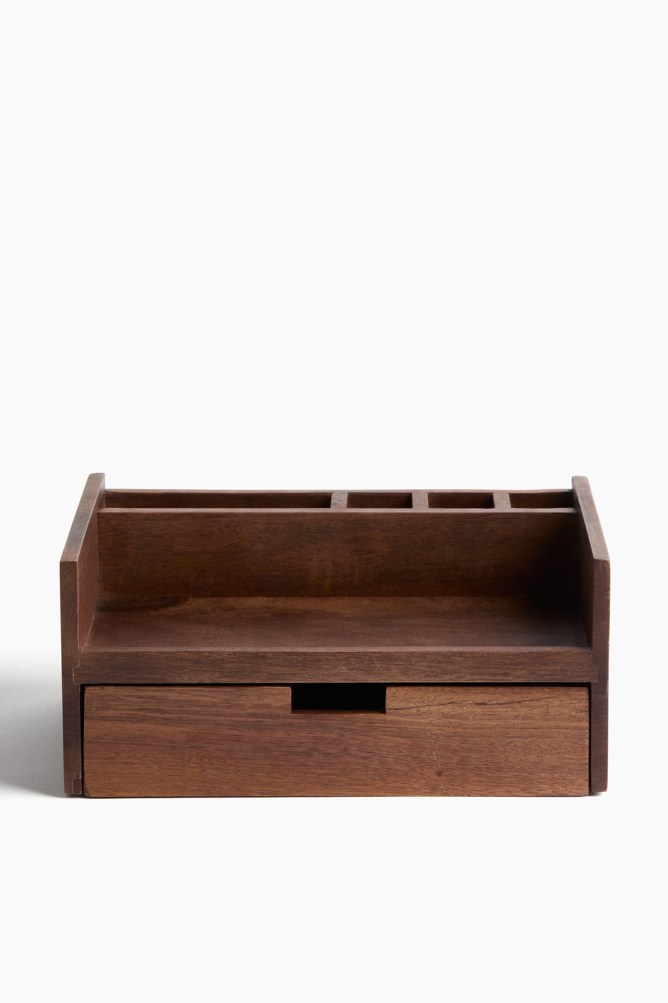 View larger image: A dark brown wooden desk organizer is facing front, featuring a long, shallow front compartment and a row of smaller, square compartments behind it on the top section. A single drawer with a rectangular cutout handle forms the bottom section.