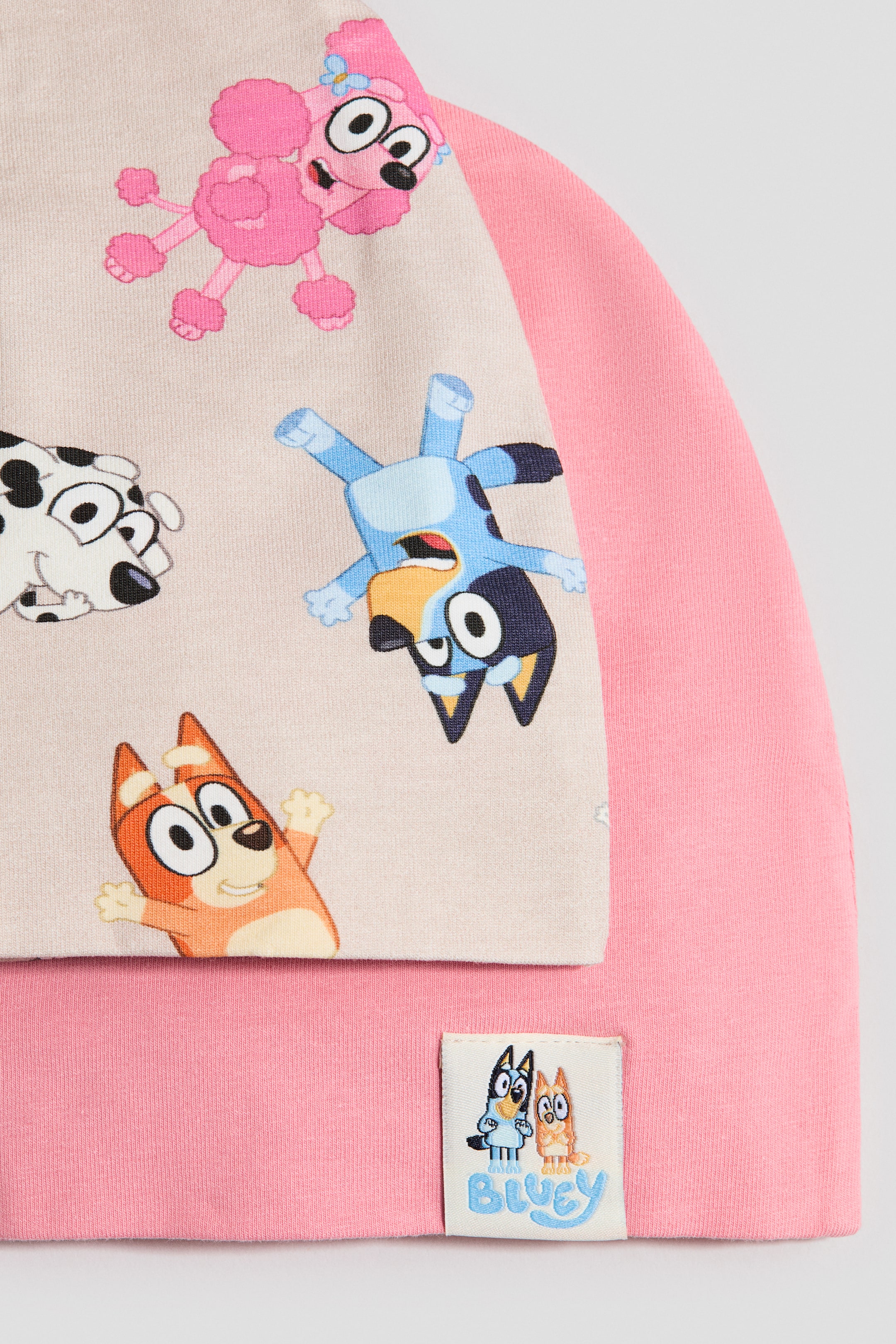 View larger image: 2-Pack Cotton Beanies - Pink/Bluey - Kids | H&M US 2