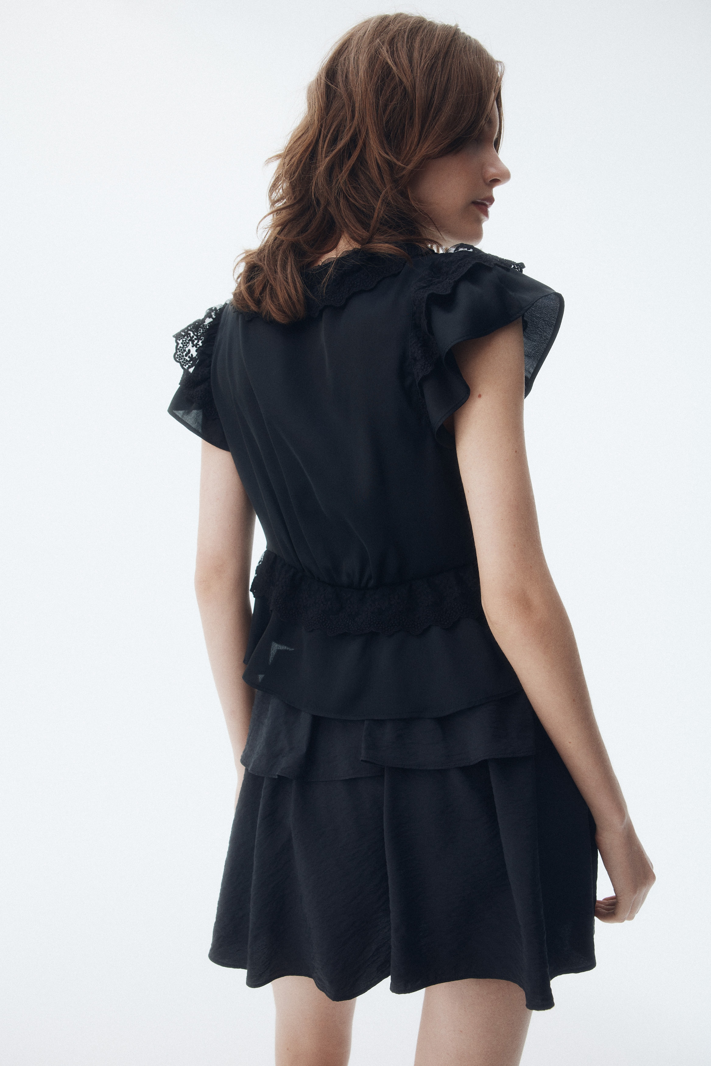 Flounce-trimmed satin blouse