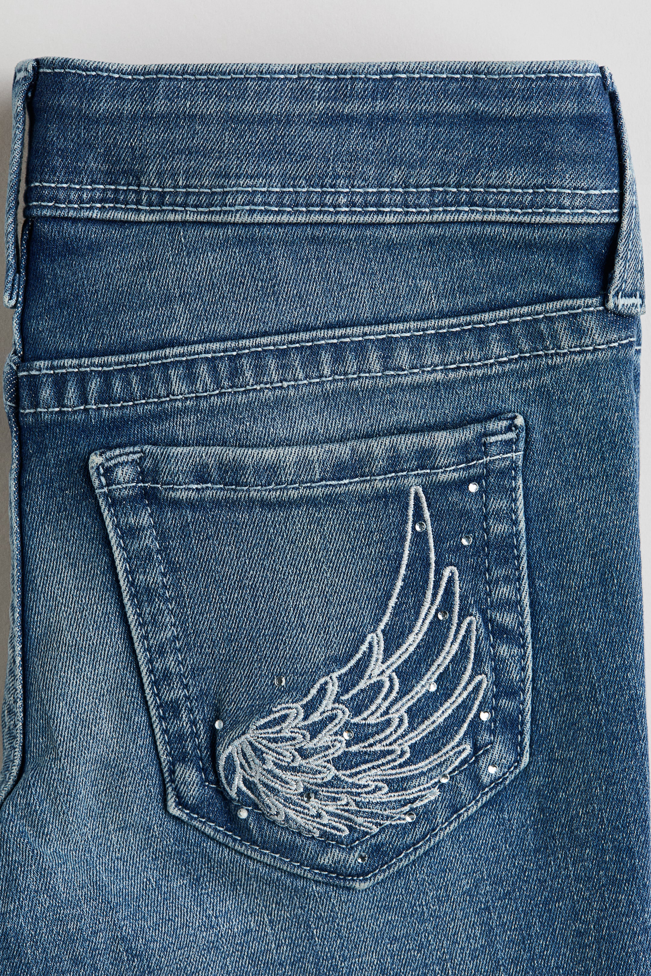 Embroidered-Detail Flared Low Jeans