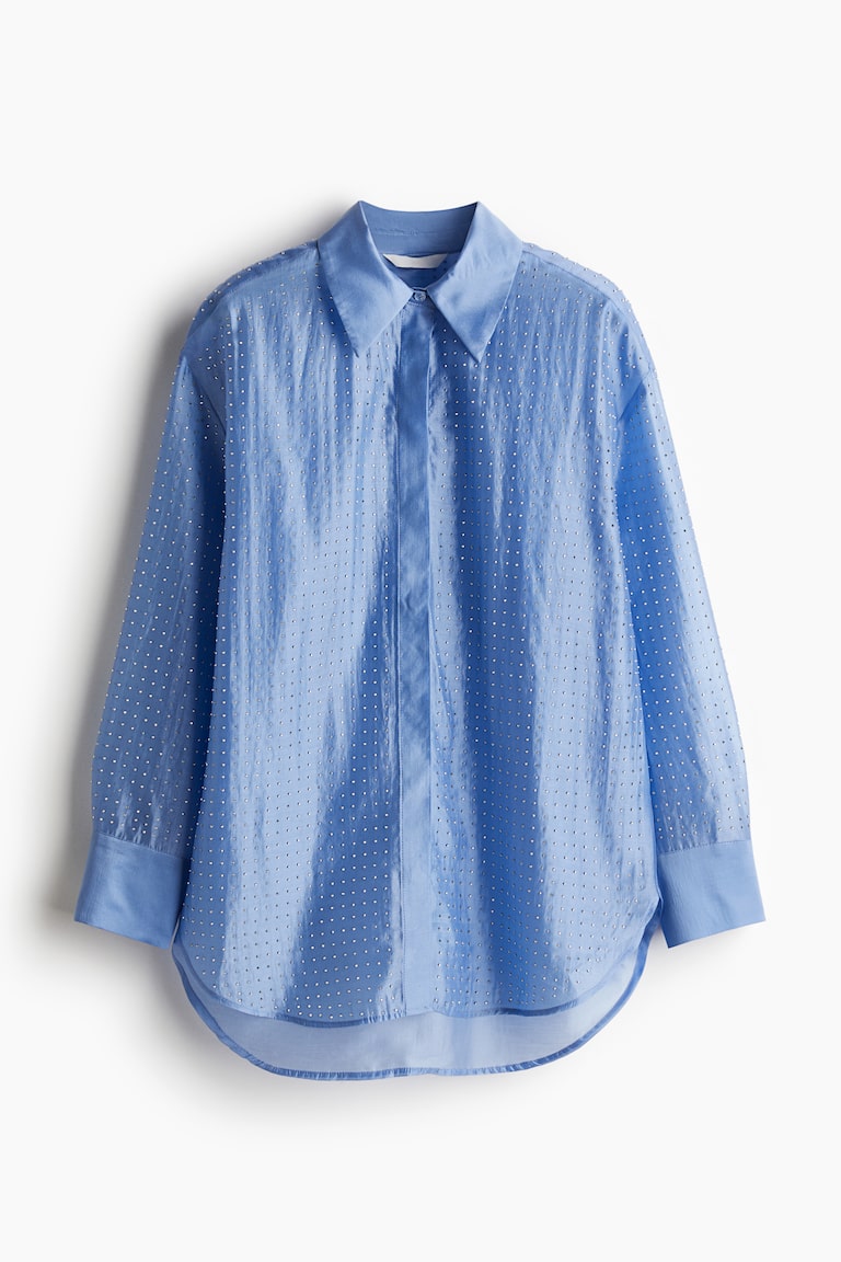 Blusa transparente con tachuelas