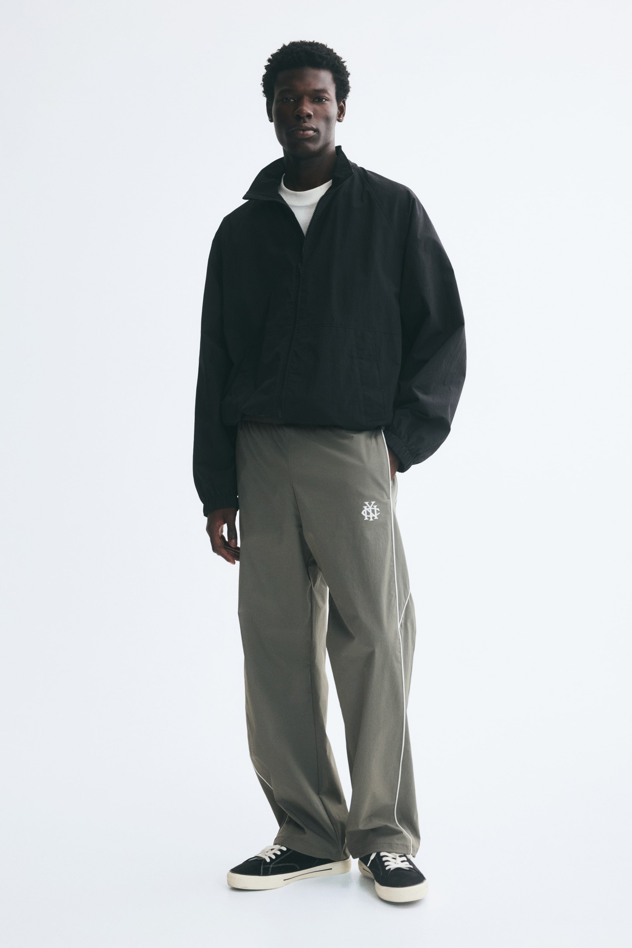 View larger image: Relaxed Fit Track pants - Light dusty green/NYC - Men | H&M 1