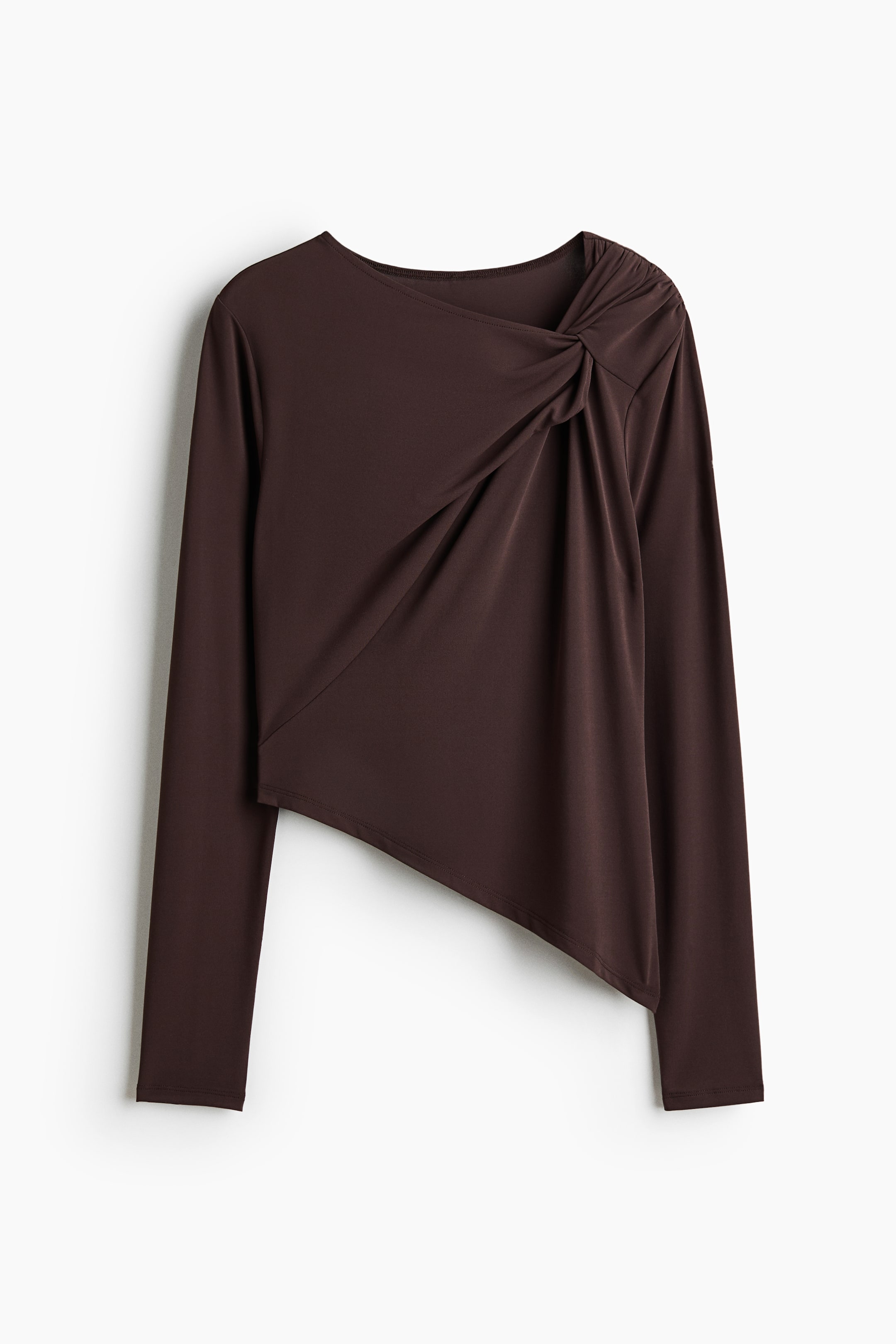 View larger image: The brown long-sleeved top showcases a knotted detail at the right shoulder, creating elegant drapes across the chest. It also features an asymmetrical hemline, with the left side designed to be shorter.