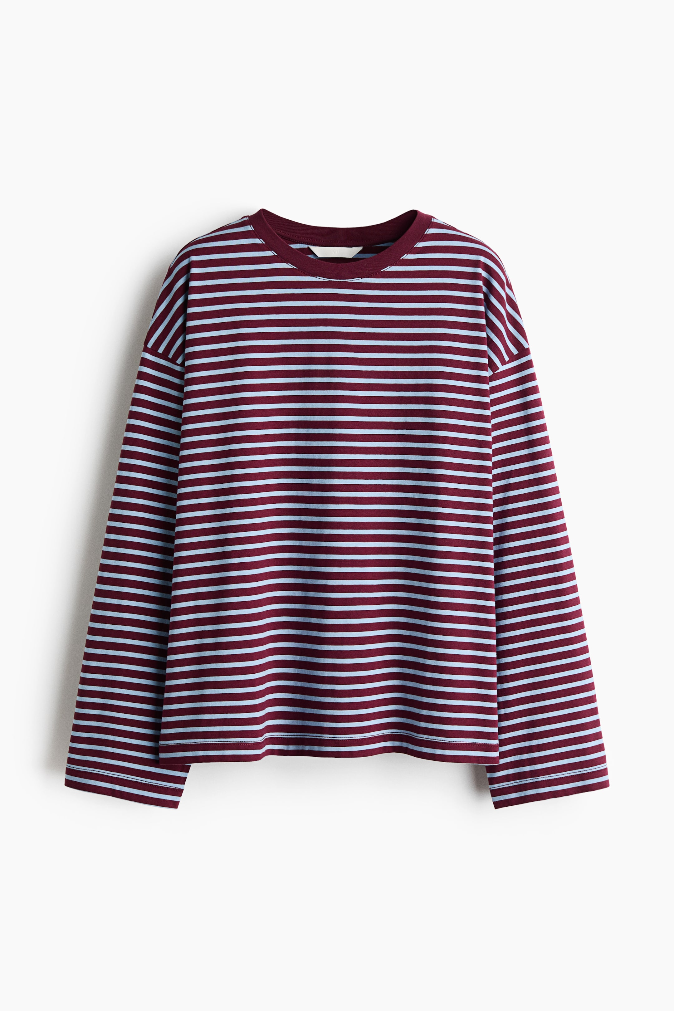 View larger image: A long-sleeved cotton jersey top is shown hanging in a front view, featuring horizontal burgundy and light blue stripes. The top has a solid burgundy crew neckline, dropped shoulders, and a straight-cut hem.
