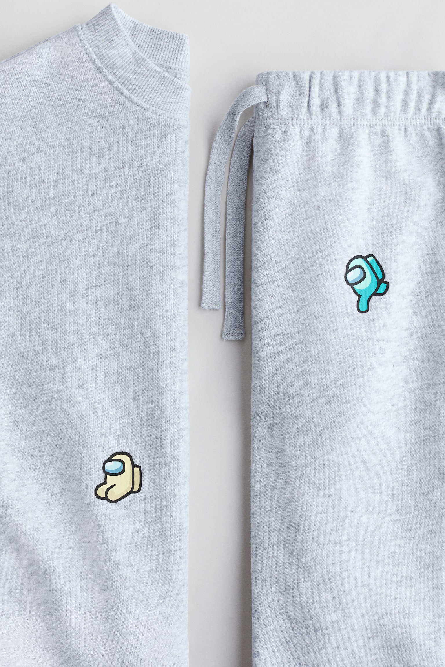 Dvoudílná souprava z teplákoviny s potiskem - Světle šedý melír/Among Us/Béžová/Marvel Comics/Šedá/Marvel Comics/Tlumená tmavomodrá/auta/Šedá/Batman/Khaki zelená/Jurassic World/Světle béžová/Marvel Comics/Tyrkysová/Mimoni/Světle žlutá/Marvel Comics/Černá/Minecraft/Jasně modrá/ježek Sonic - 2