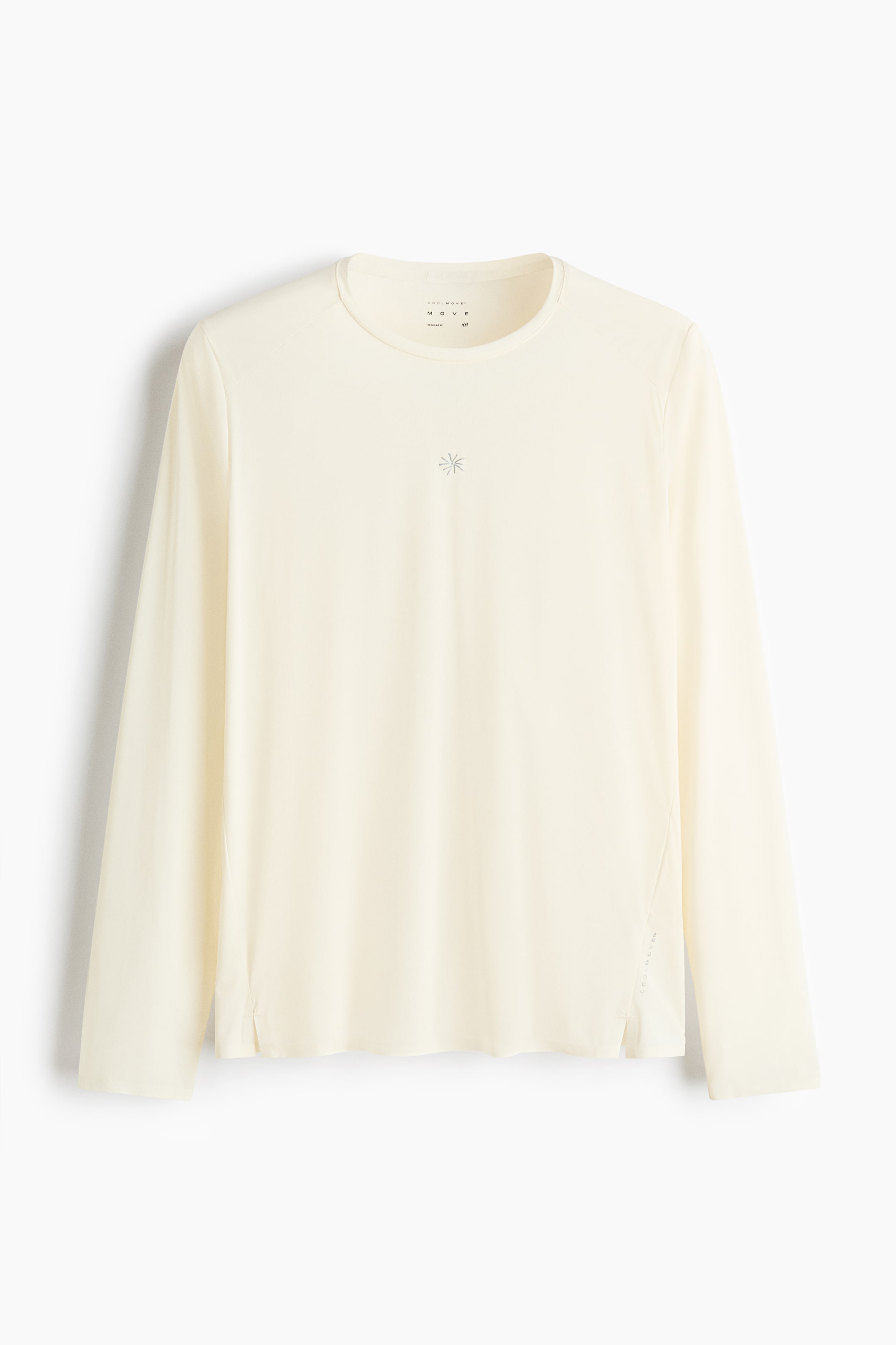 View larger image: A long-sleeved top is shown front-facing in a light cream color, featuring a crew neck and long sleeves. A small, light grey star-like logo appears on the upper chest, and the top is designed with a straight hem and small side slits.