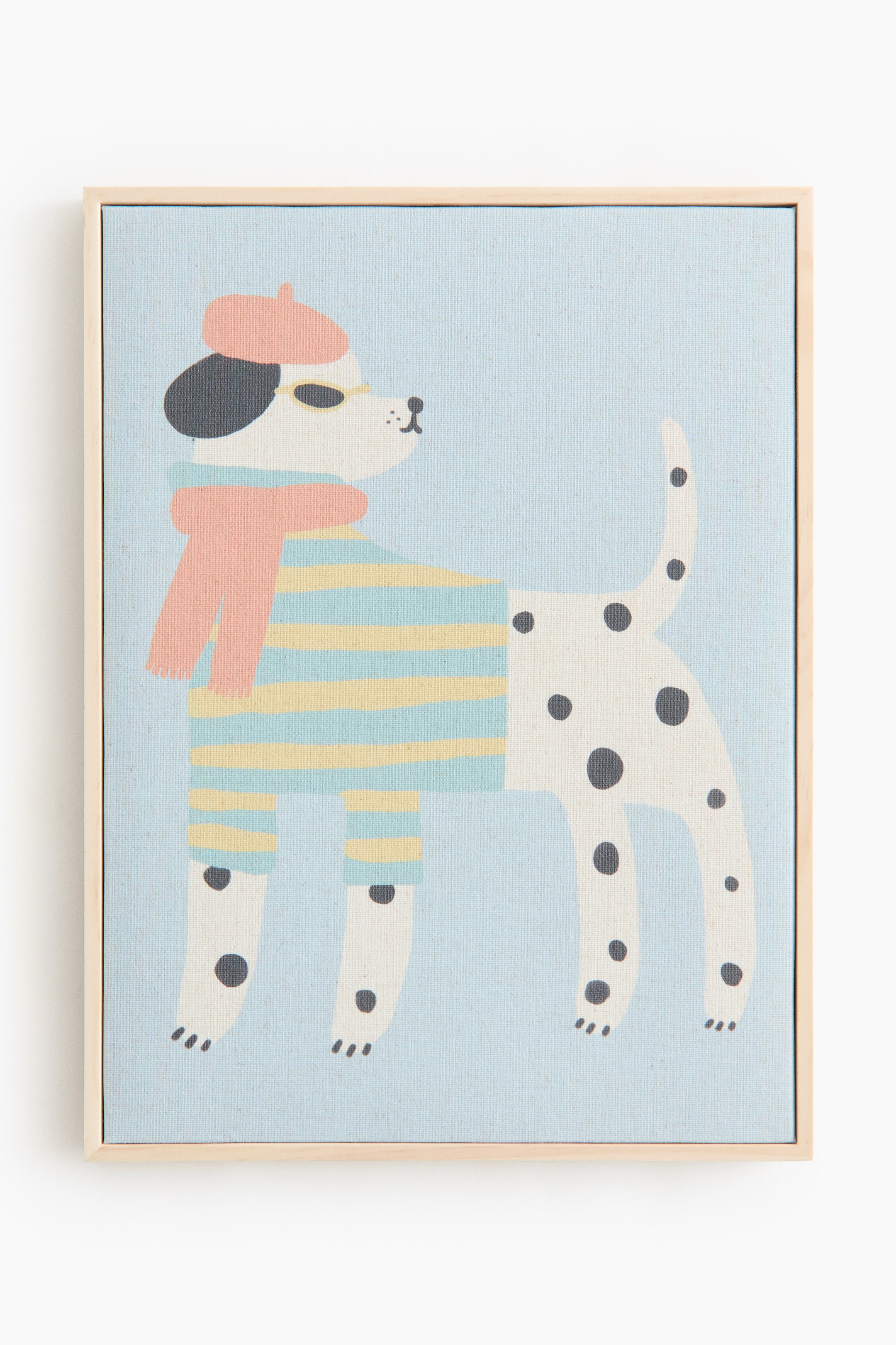 View larger image: A front view of wall art is featuring a canvas print with a light wood pinewood frame. The print is depicting an animal motif of a white dog with black spots, wearing a pink beret, yellow sunglasses, a pink scarf, and a blue and yellow striped sweater, all on a light blue background.