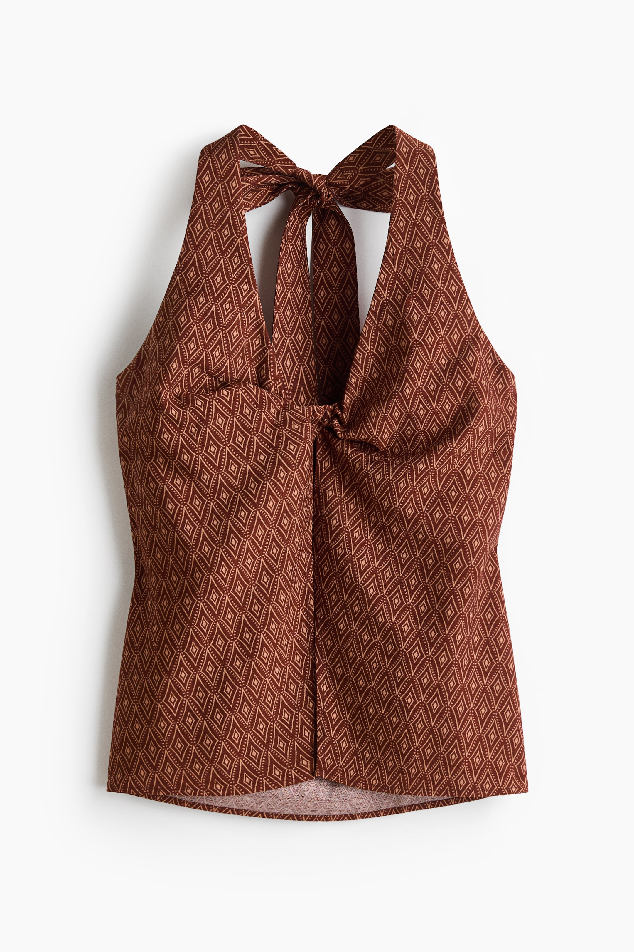 View larger image: A brown halter top with a light brown diamond pattern shown from the front. It features a V-neckline, a tied bow at the back of the neck, and a knotted detail at the centre-front bust.
