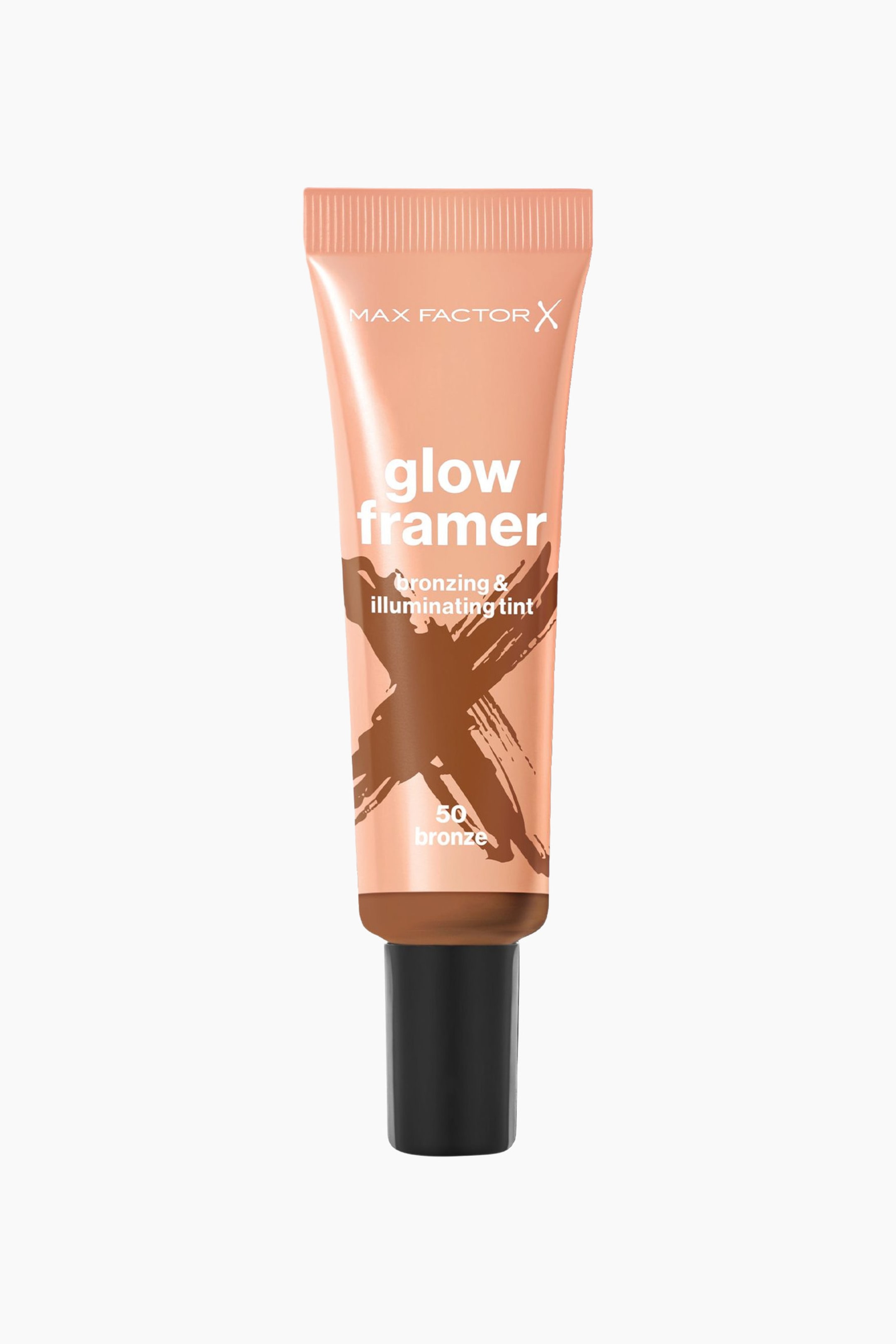 Se større billede: Et ferskenfarvet klemtube står oprejst og viser teksten "MAX FACTOR X glow framer" samt et brunt "X" design på forsiden. Tuben viser også teksten "bronzing & illuminating tint" og "50 bronze" og er forsynet med et sort låg.