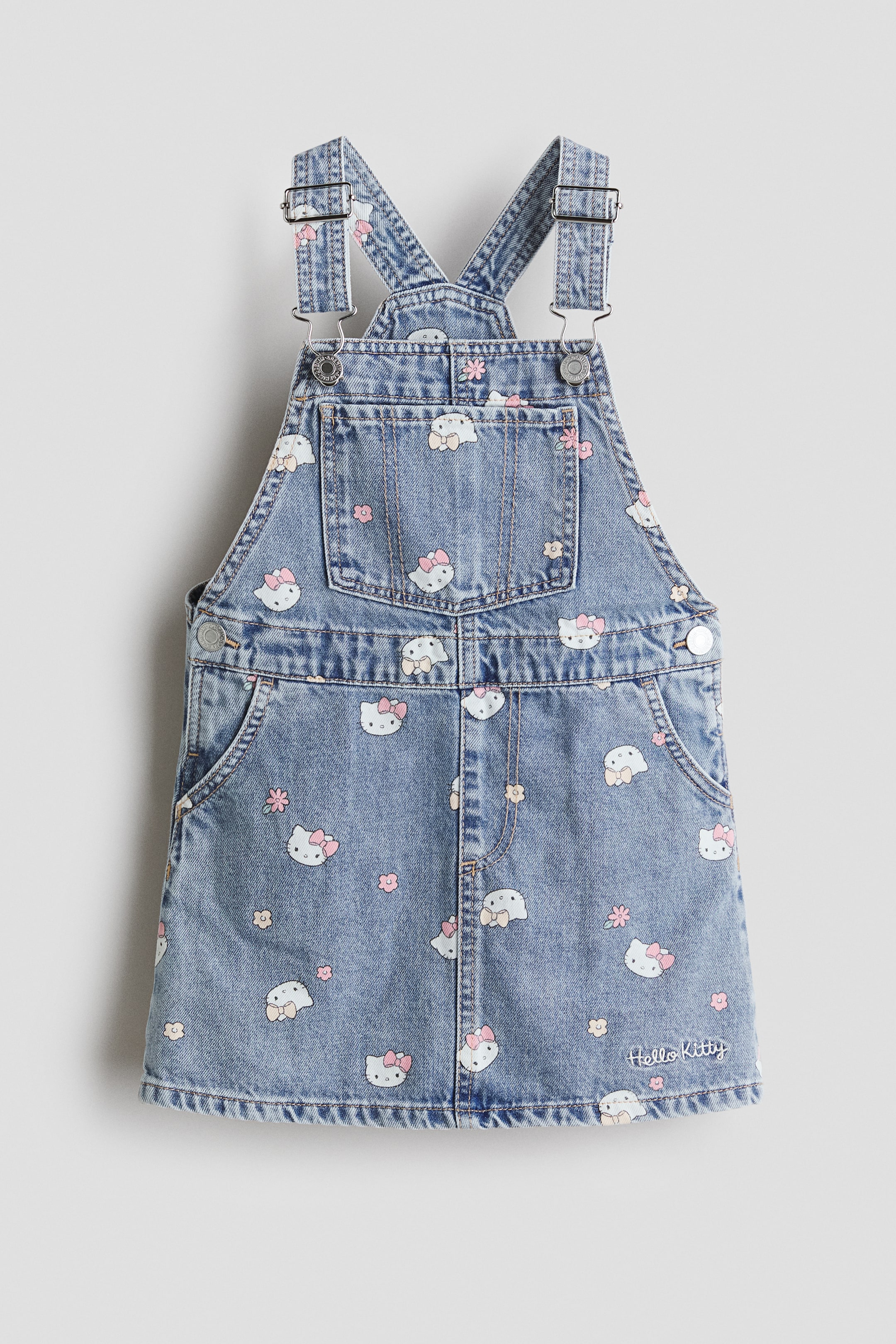 View larger image: Embroidery-Motif Overall Dress - Denim blue/Hello Kitty - Kids | H&M US 1