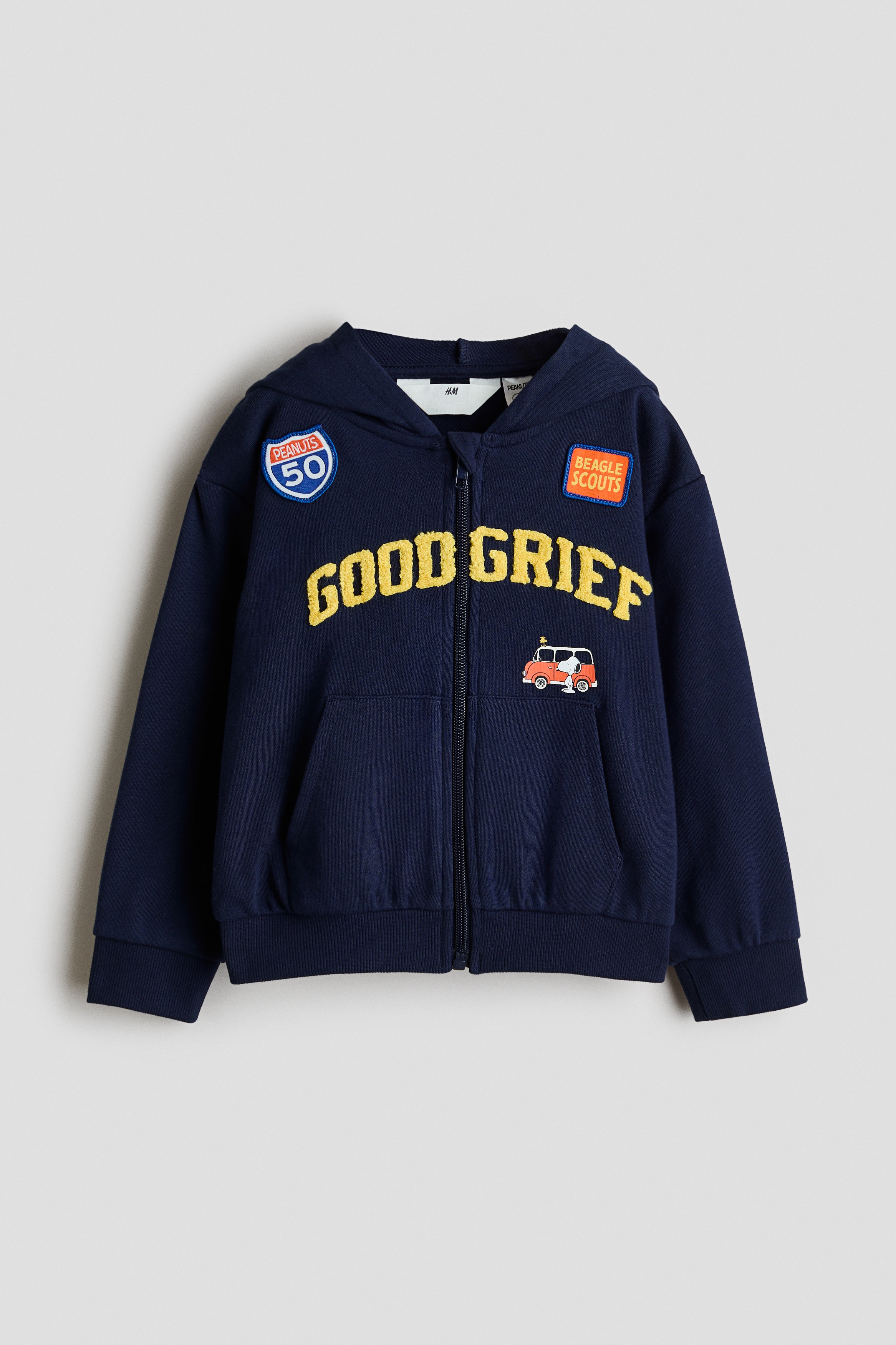 ãã¤ãã¼ãã«ã¼ã®ã¸ããã¢ãããã¼ã«ã¼ã«ãã°ã©ãã£ãã¯ãããã¨ãã­ã³ãã«ããããããé»è²ã®ãGOOD GRIEFãããªã³ããæ½ããã¦ãããã¢ãã«ãçç¨ãã¦ãã¾ããã¢ãã«ã¯ä¸¡æããã­ã³ããã±ããã«å¥ãã¦ç«ã£ã¦ãããã©ã¤ããã«ã¼ã®è¥ä»ãã·ã£ãã®ä¸ã«éã­ããã£ããã¨ããããã ã¸ã¼ã³ãºãåããã¦ãã¾ãã
