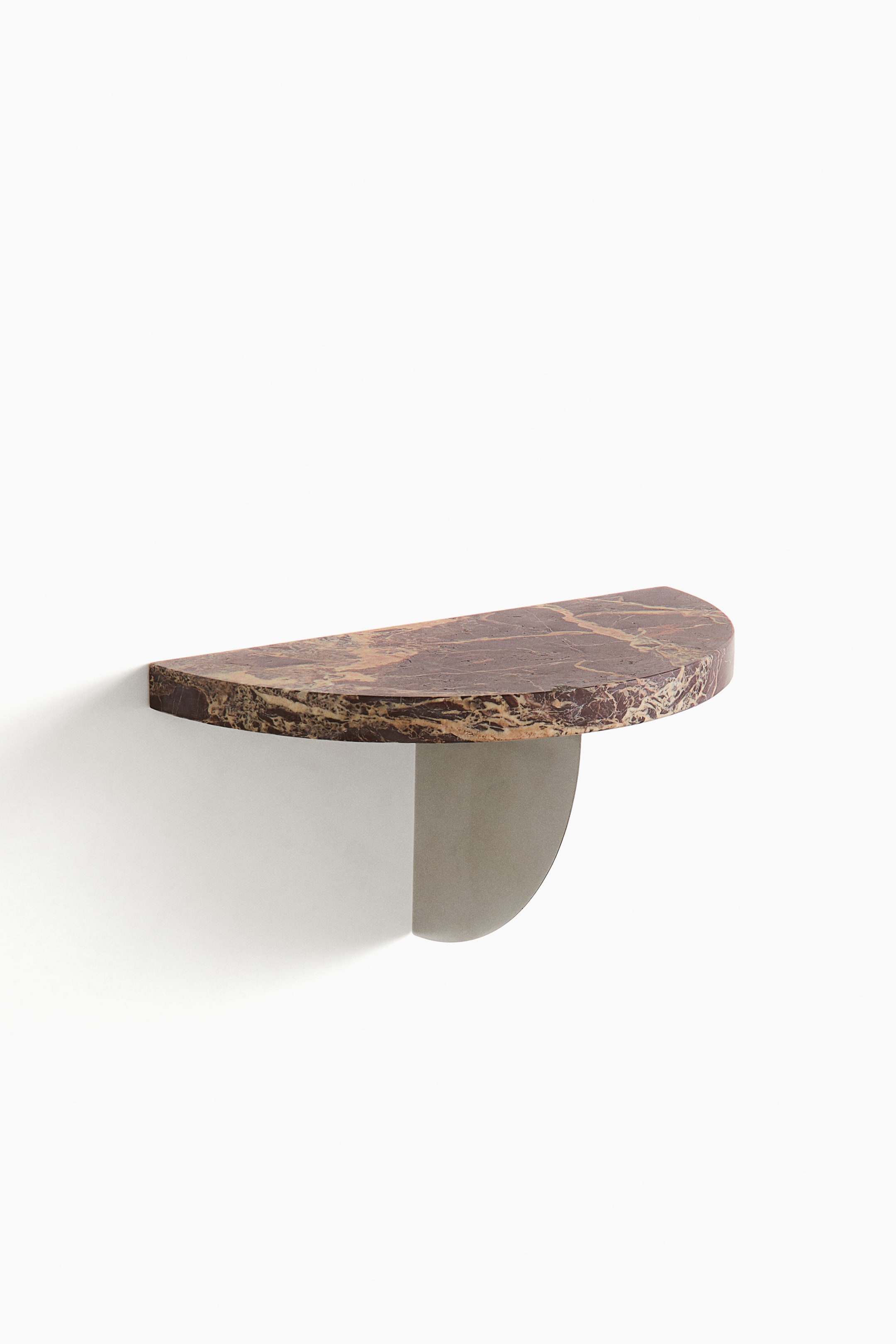 View larger image: A wall-mounted shelf features a D-shaped top made of reddish-brown marble with light veining, supported by a curved grey metal bracket underneath, seen from a slight front-side angle.