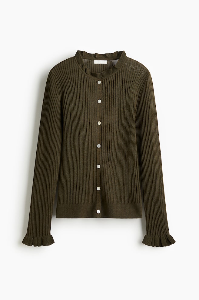 A dark olive green ribbed knit cardigan is being shown from the front, featuring a ruffled crew neck, a full button-front closure with seven white buttons, and ruffled cuffs on its long sleeves. - 1