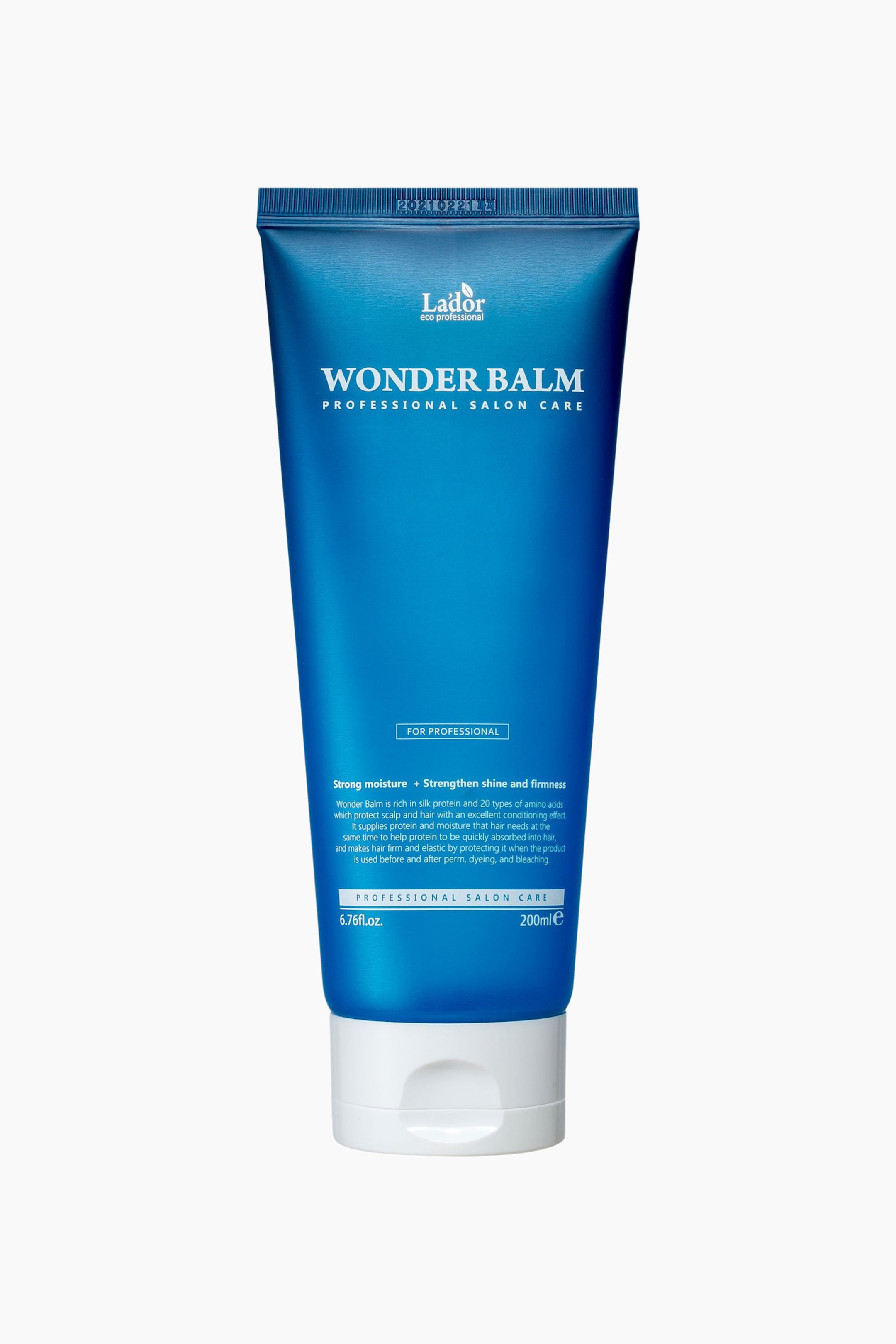 Se større billede: Et blåt rør med Lador Wonder Balm professionel salonpleje står oprejst, med fronten fremad. Det viser mærkenavnet Lador, produkttitlen Wonder Balm og volumenmålinger på forsiden, med en hvid hætte i bunden.