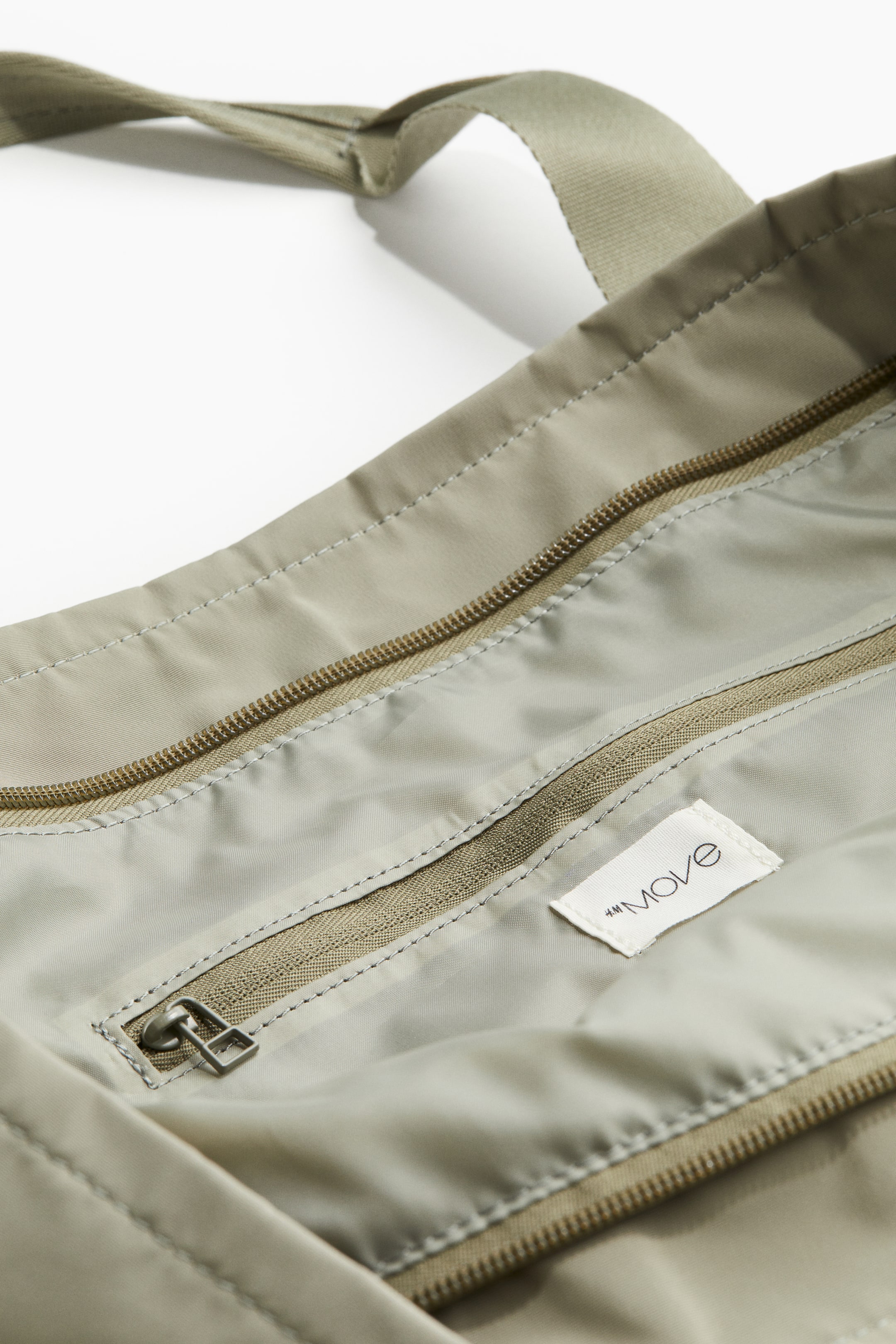 Water-repellent sports bag - Light khaki green - Ladies | H&M GB