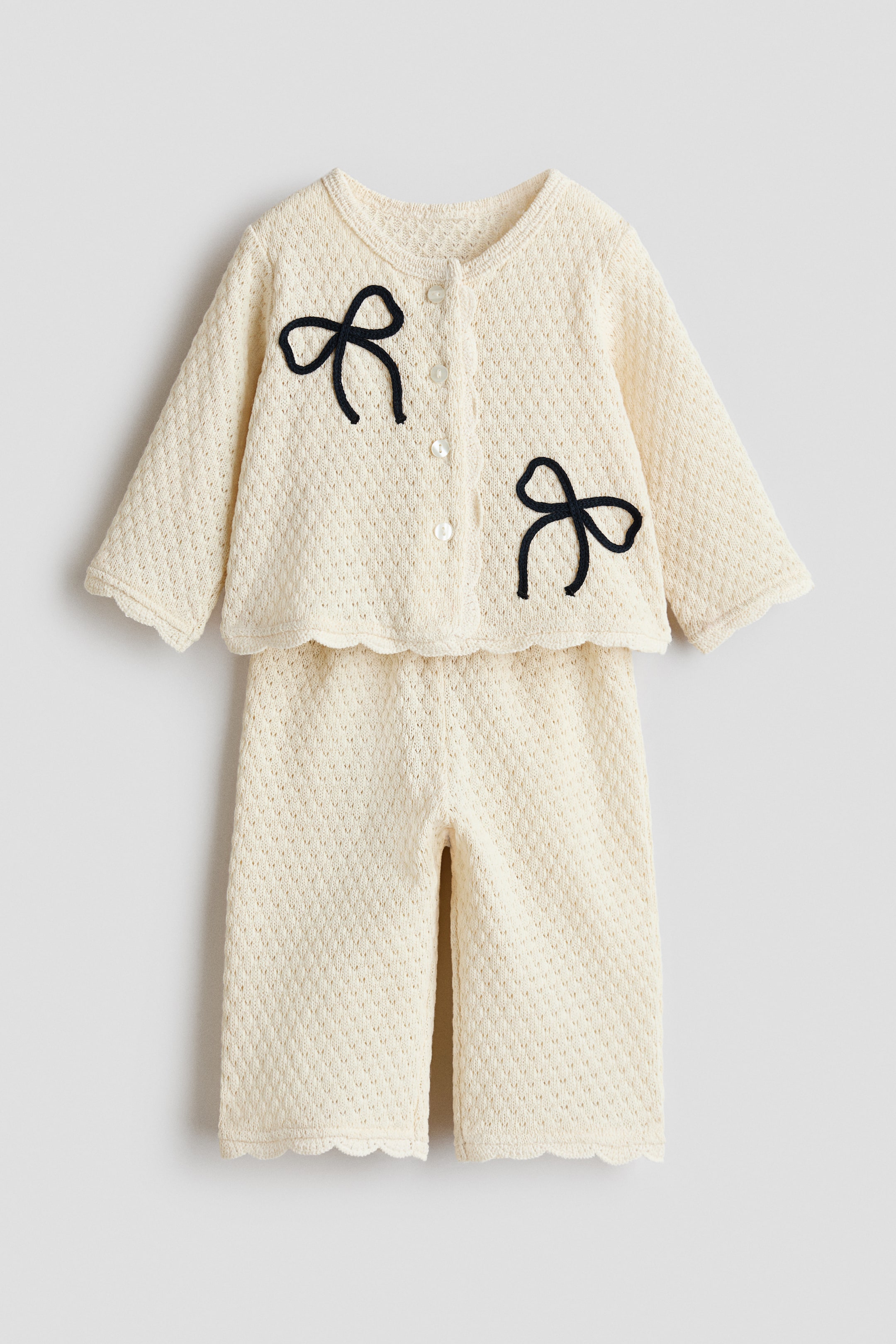 Переглянути збільшене зображення: 2-piece pointelle-knit set - Cream/Bows - Kids | H&M UA 1